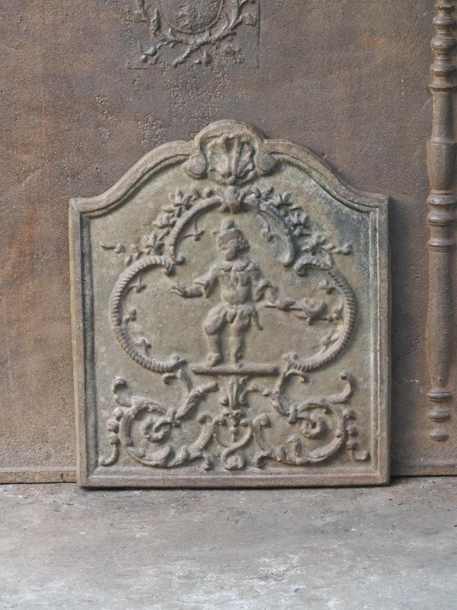 20th century French Louis V style fireback with a street musician.

The fireback is made of cast iron and has a natural brown patina. Upon request it can be made black / pewter at no extra costs. The fireback is in a good condition and does not have
