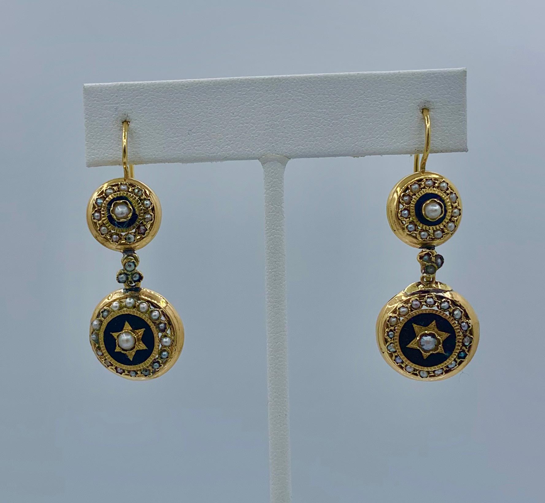 This is a very rare pair of early Antique French Georgian - Victorian Dangle Drop Earrings in 18 Karat Gold with a stunning star motif with enamel and pearls and a dramatic 1 7/8 inches long.   These antique earrings are of the highest quality. 