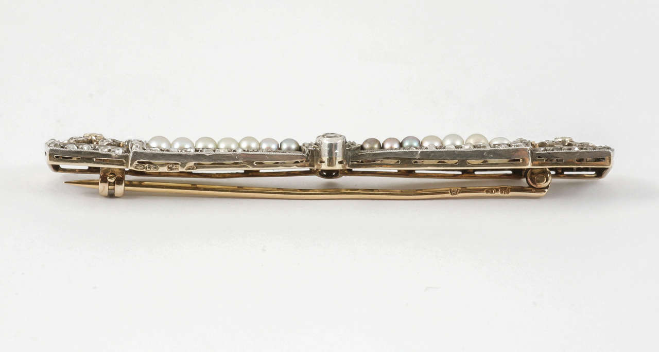 Edwardian Bow Brooch with Diamonds & Natural Pearls in Platinum, French circa 1910 For Sale
