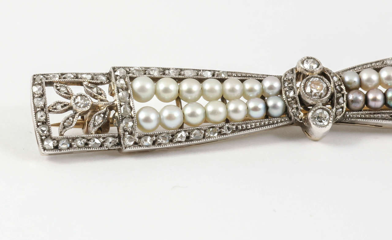 Women's Bow Brooch with Diamonds & Natural Pearls in Platinum, French circa 1910 For Sale