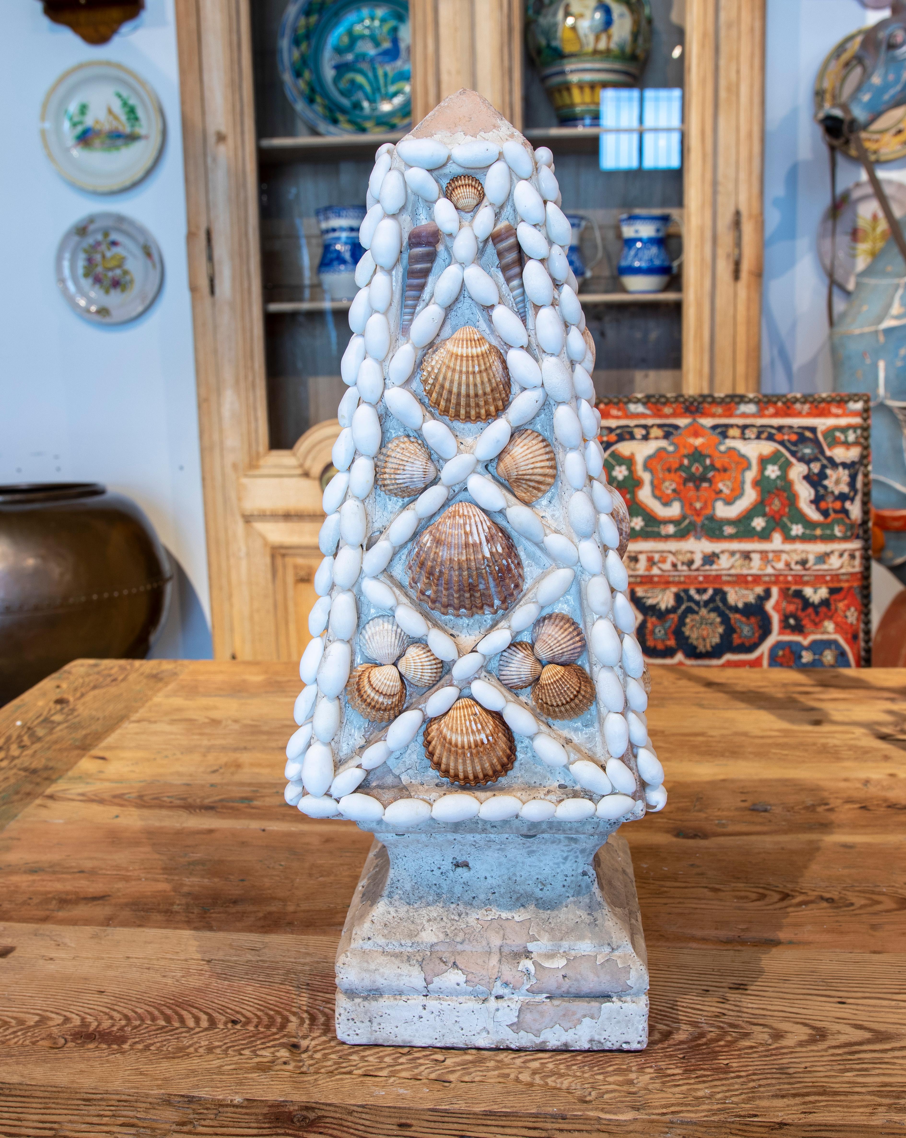French natural Terracotta Obelisk decorated with seashells.