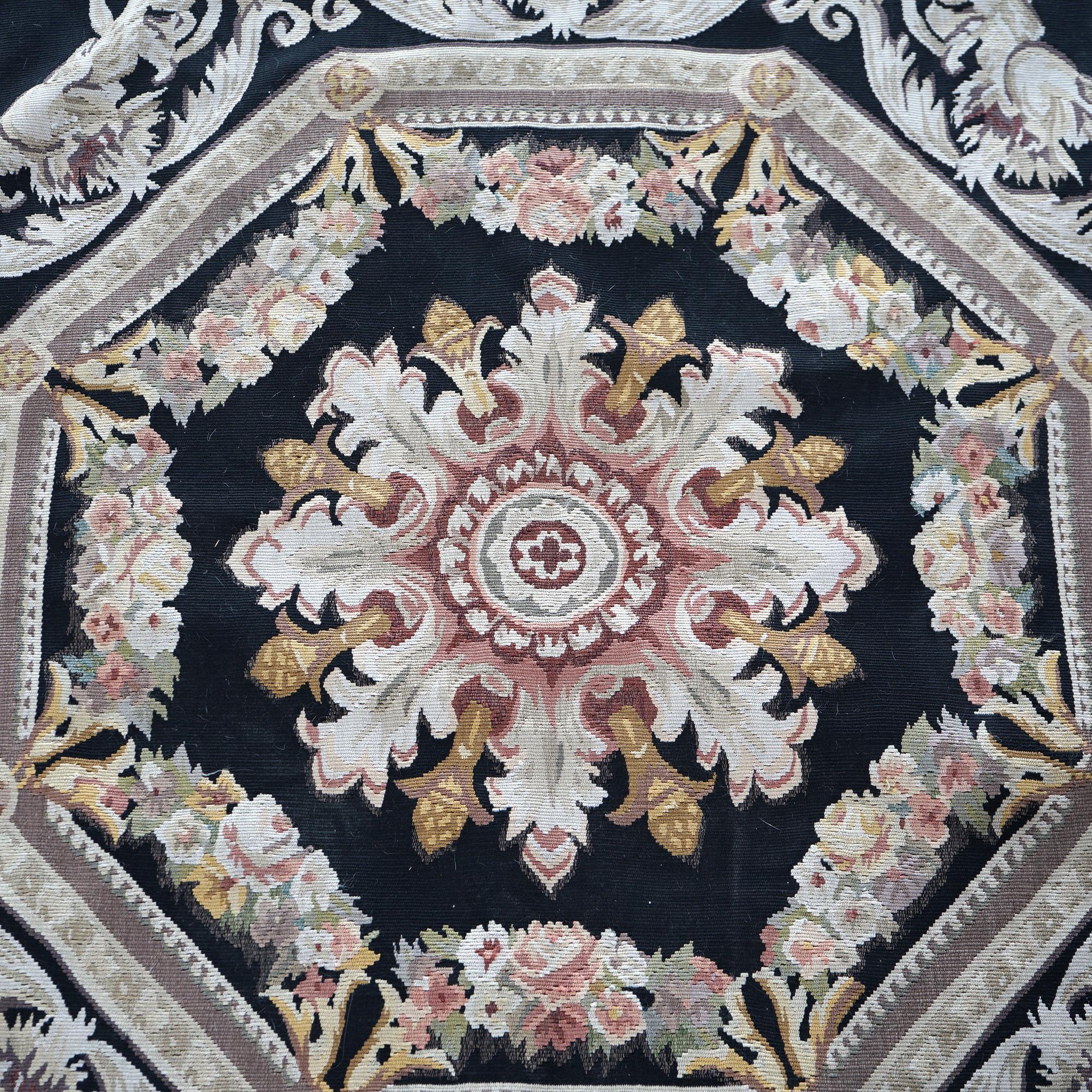 A French Aubusson rug offers wool needlepoint construction with  central medallion and foliate elements throughout, 20th C

Measures - 98