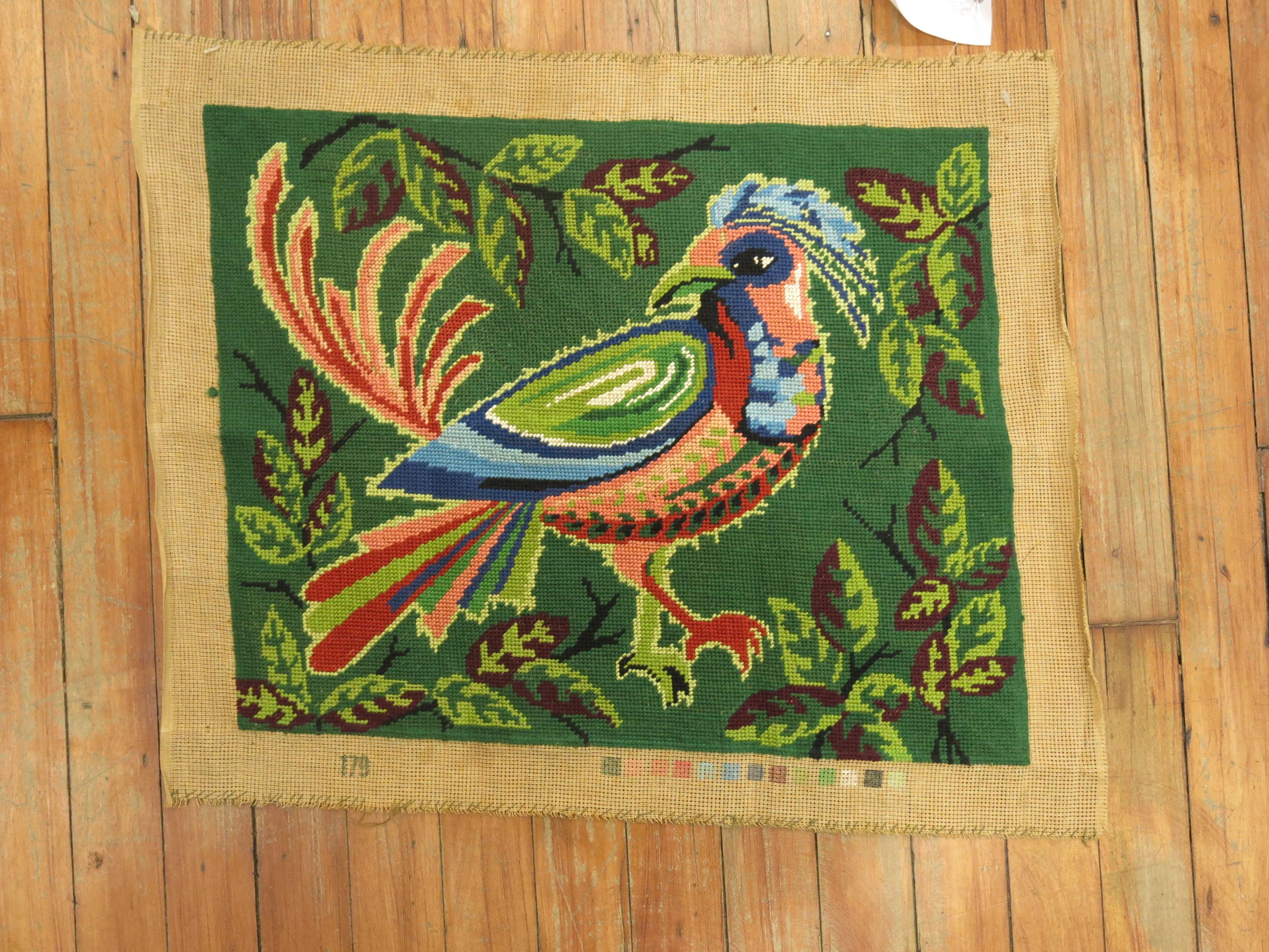 An interesting French needlepoint with a colorful pigeon from the middle of the 20th century. The bottom has an interesting set of color samples too.
