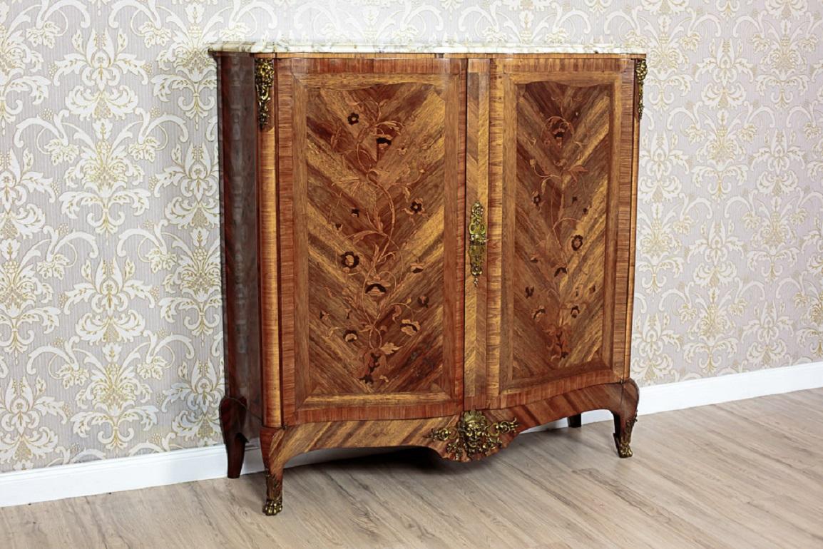 19th-Century Walnut French Neo-Baroque Commode With Marble Top

This late 19th-century piece is a two-door commode with a marble top. The concave-convex shaped fronts of the doors feature a white marble top with a profiled edge. The surfaces of both