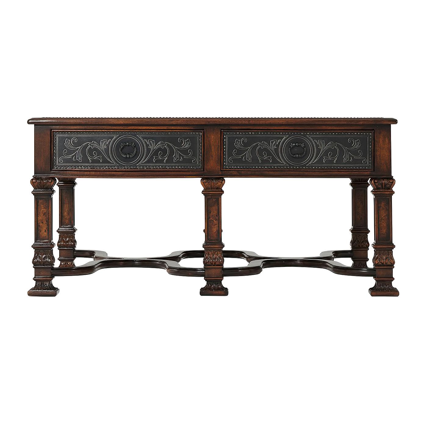 A French neoclassic style etched brass paneled cocktail table, the top and sides with floral decoration, the frieze fitted with two drawers to one side, on poplar burl veneer square paneled legs with carved capitals and bases joined by wavy 'X'