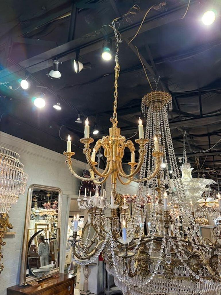 Fine Quality 19th century French Neo-classical dore' bronze chandelier with rams heads. Circa 1890. The chandelier has been professionally rewired, comes with matching chain and canopy. It is ready to hang!
