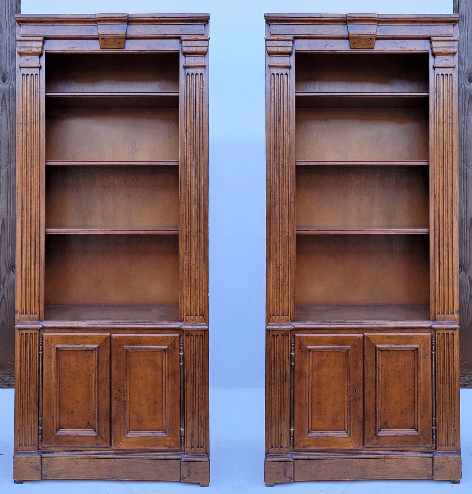 This is an amazing pair of French neo-classical style bookcases hand crafted by the Italian designer Guido Zichele for Bloomingdales. Note the elongated 19th century French style hinges ! They do have keys, and the shelves are adjustable. They are