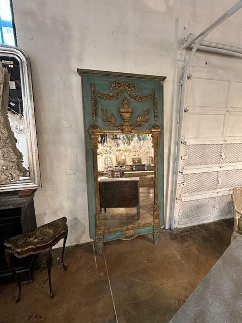 19th century French Neo-classical carved and parcel gilt trumeau mirror. Circa 1840. Perfect for today's transitional designs!