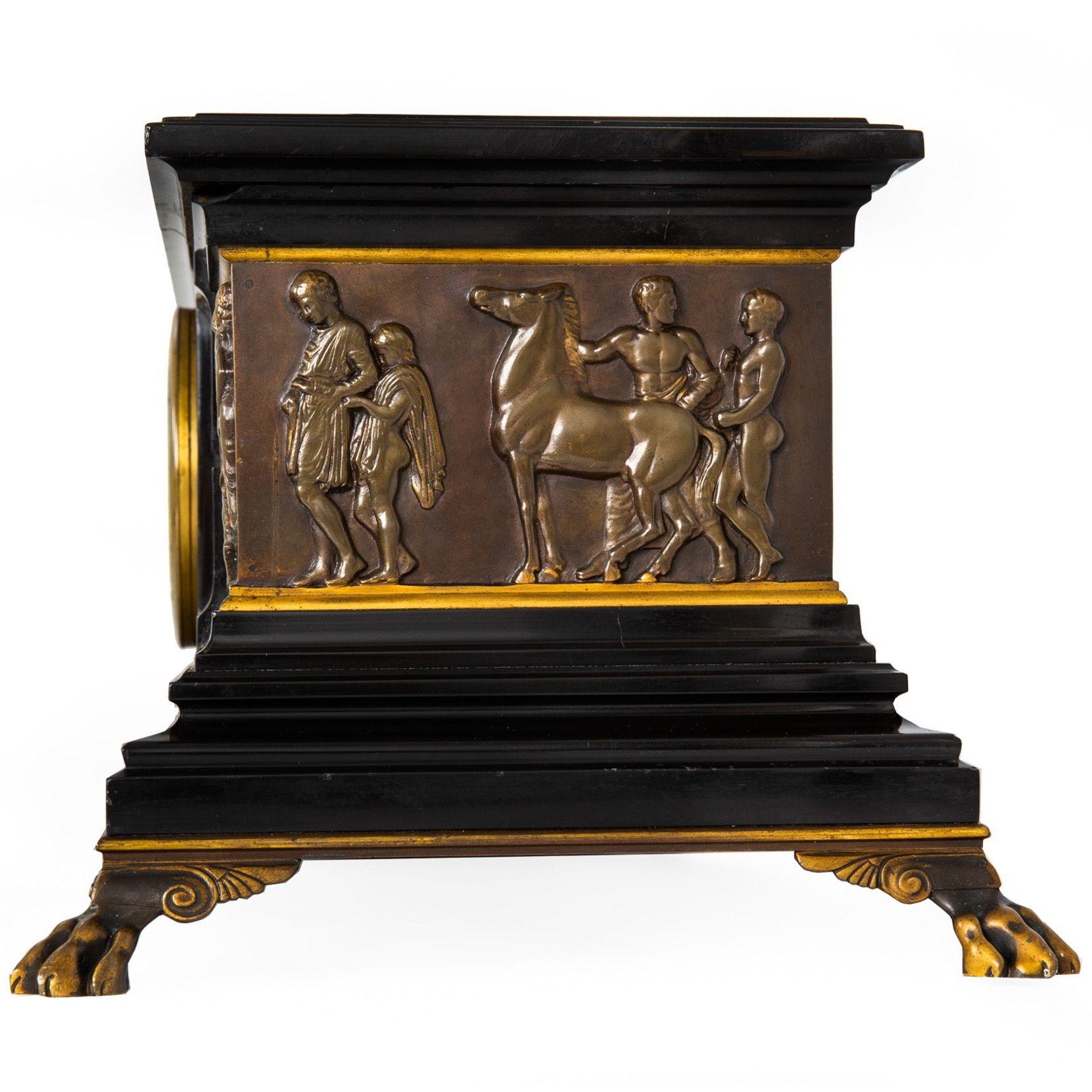 FRENCH NEO-GREC BLACK MARBLE AND PATINATED BRONZE MANTEL CLOCK
Edited by F. Barbedienne Fondeurs, Paris (faded engraving on dial), movement by Charles Boye circa 1880-1900
Item # 303PPQ23M 

A very nice mantel clock in the Neo-Grec taste cast and