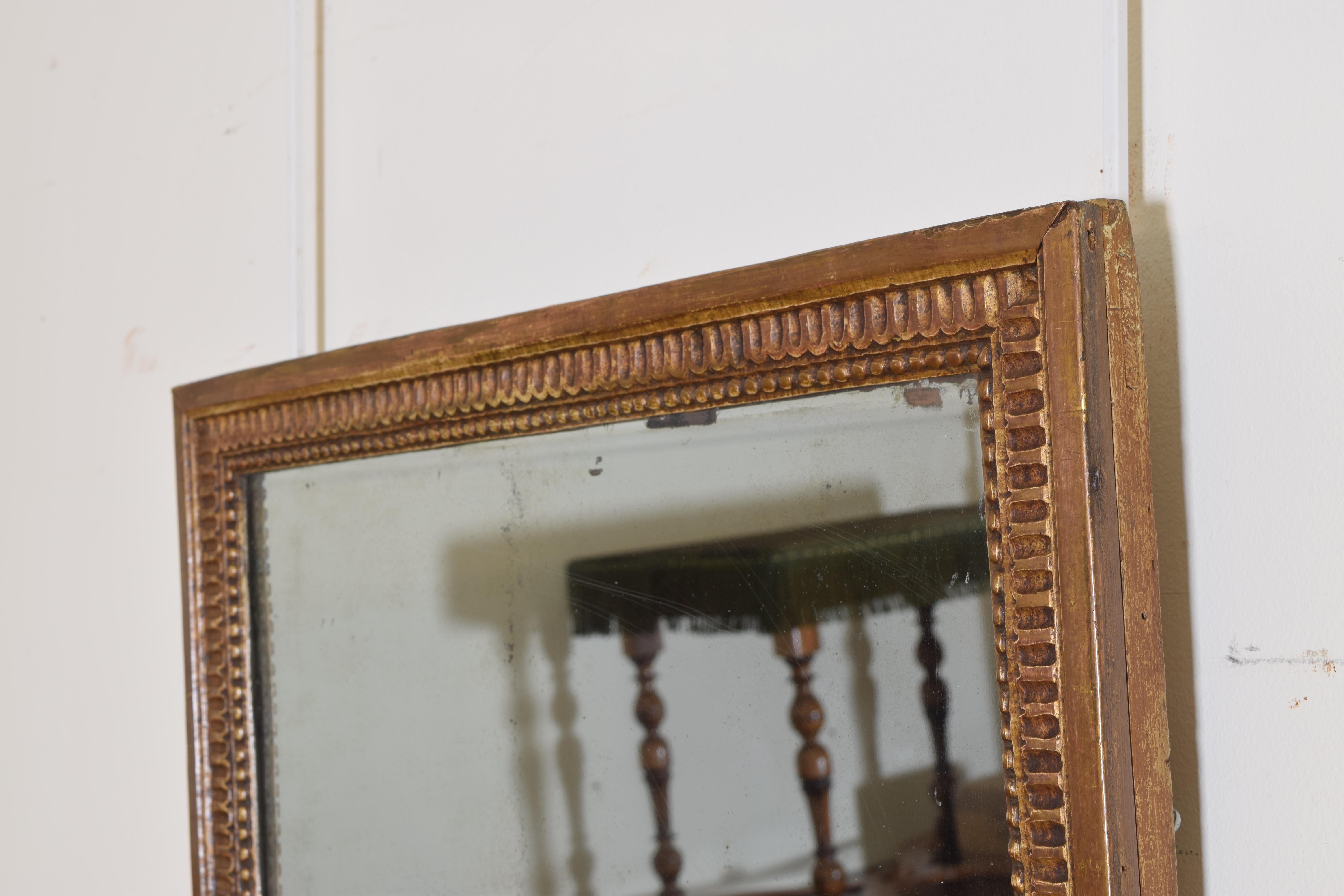 French Neoclassic Carved Giltwood Wall Mirror, First Quarter 19th Century In Fair Condition In Atlanta, GA