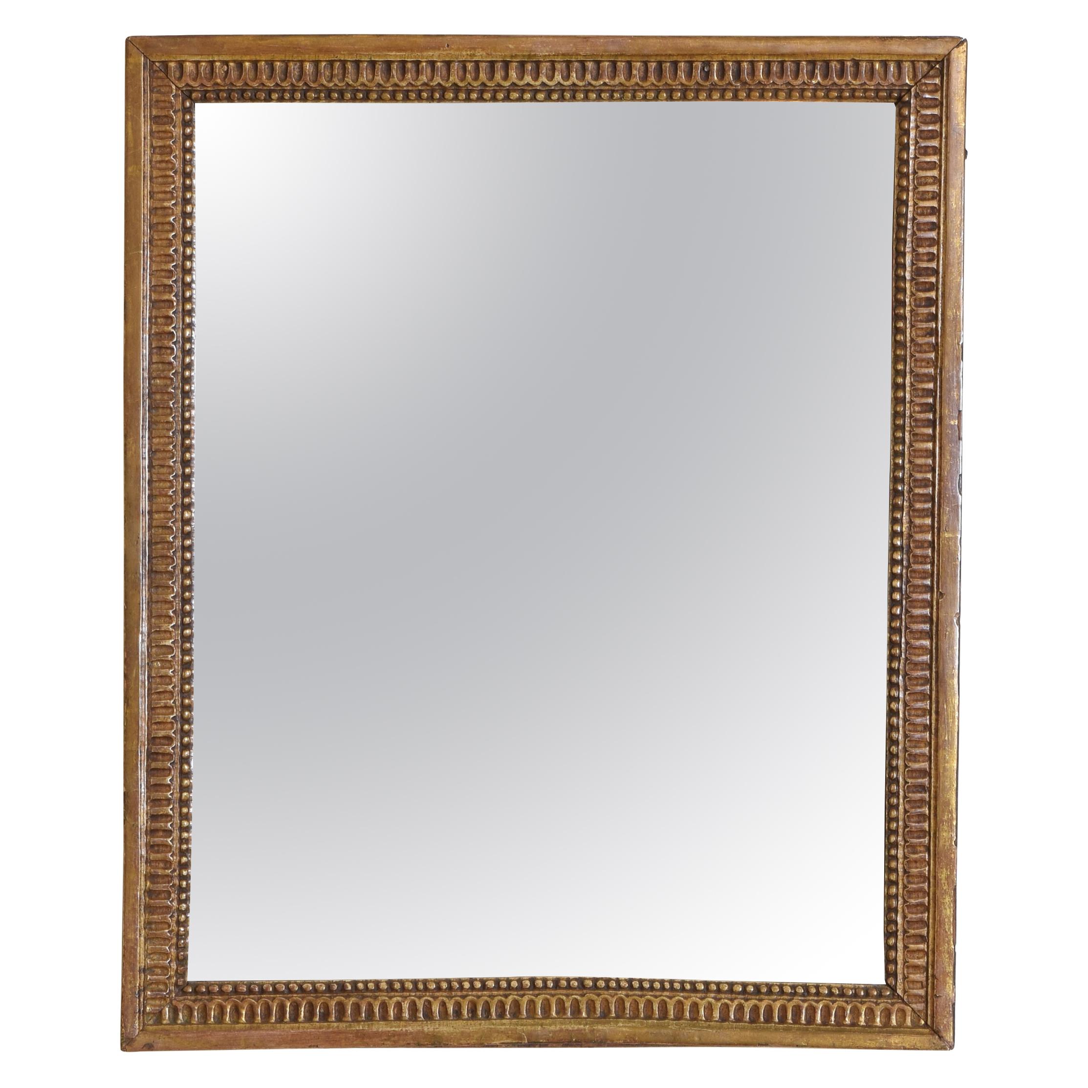 French Neoclassic Carved Giltwood Wall Mirror, First Quarter 19th Century