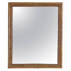 French Neoclassic Carved Giltwood Wall Mirror, First Quarter 19th Century