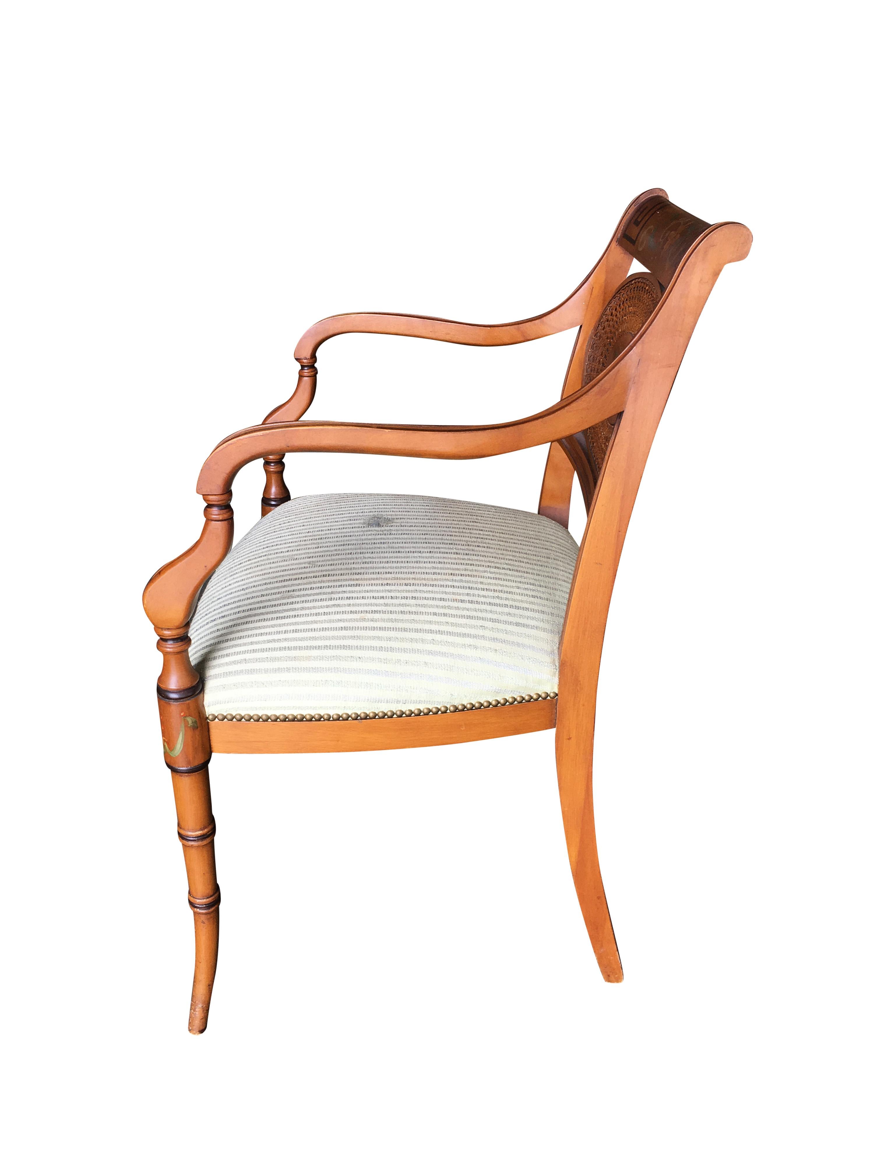 French neoclassic dining chair with hand-painted woven wicker back and sculpted legs.