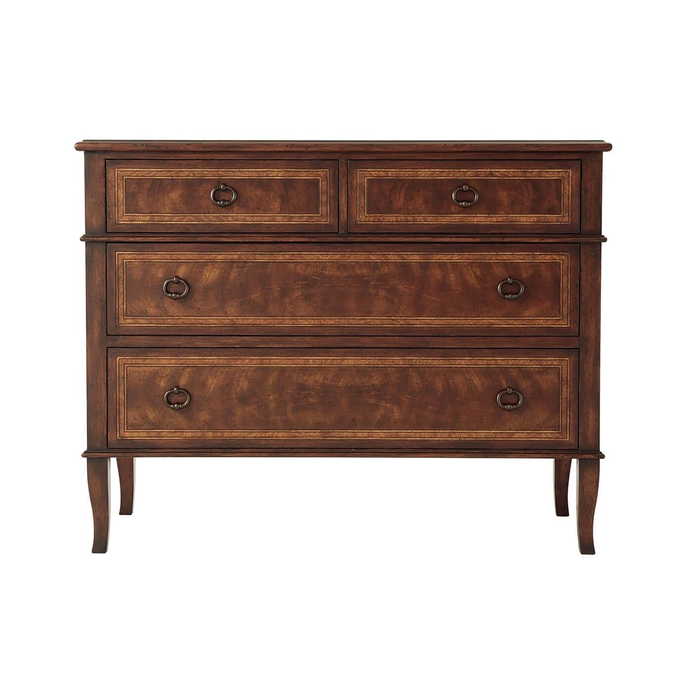 A French Neoclassic style mahogany and cerejeira veneered chest of drawers, the rectangular crossbanded top above two short frieze drawers and two further long graduated drawers, on splayed legs. 

Dimensions: 46