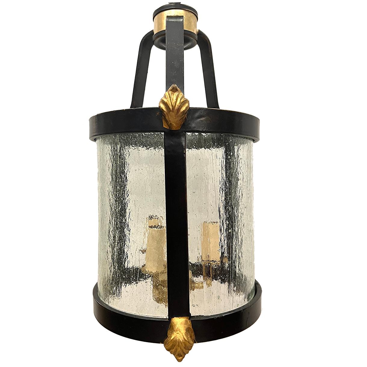 A circa 1920's French black and gilt neoclassic lantern with 3 lights.

Measurements:
Minimum drop: 21