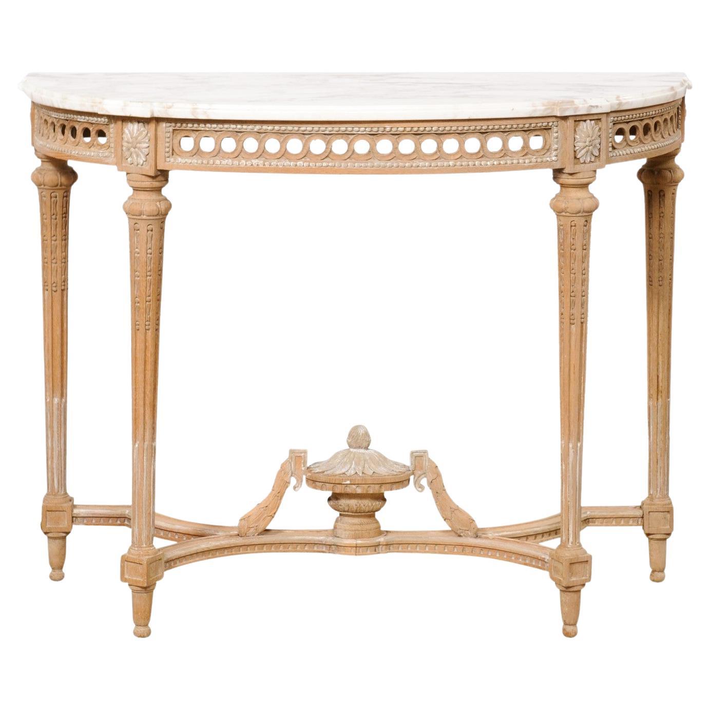 Table console en marbre de style néoclassique français avec joli fleuron en forme d'urne sur la face inférieure