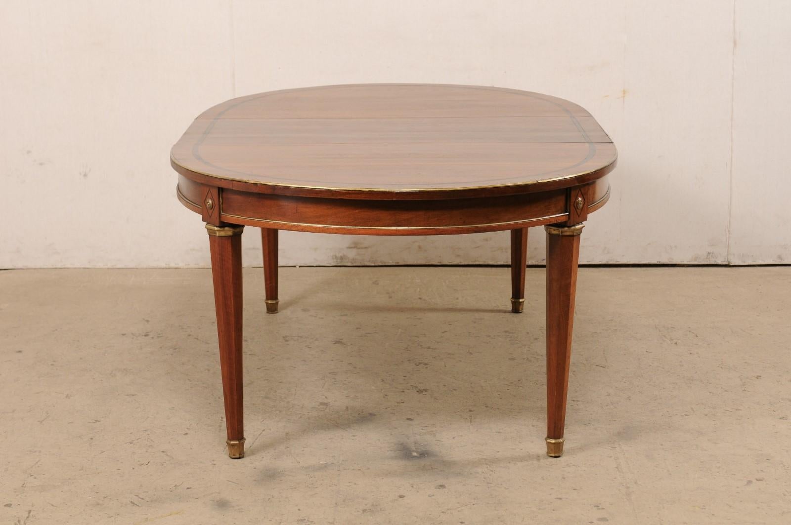 French Neoclassic Style Oval Table with Brass Trim & Accents '1 Leaf Extension' In Good Condition For Sale In Atlanta, GA