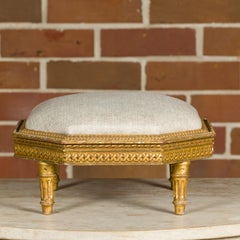 French Neoclassical 19th Century Carved Giltwood Footstool with Linen Upholstery