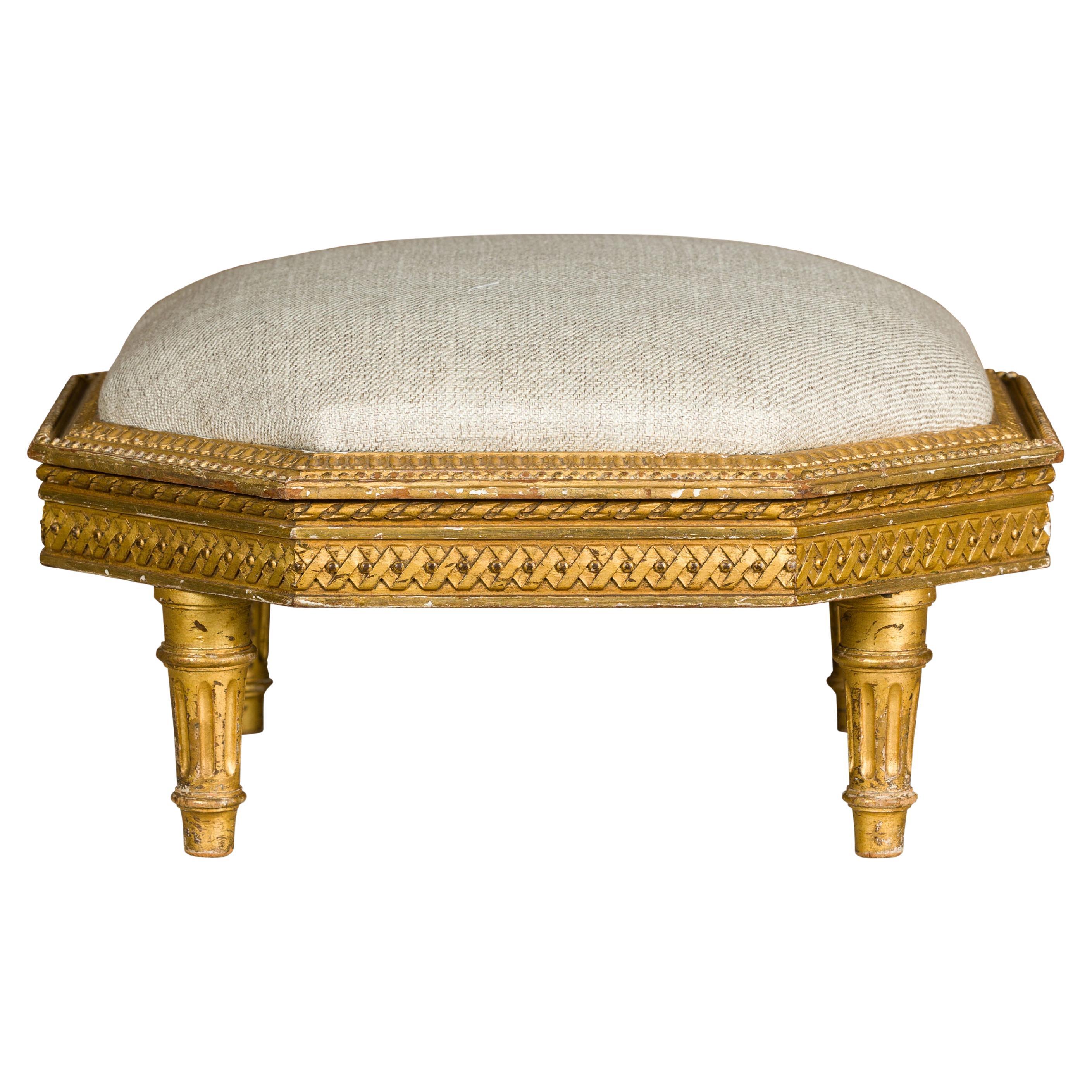 French Neoclassical 19th Century Carved Giltwood Footstool with Linen Upholstery For Sale