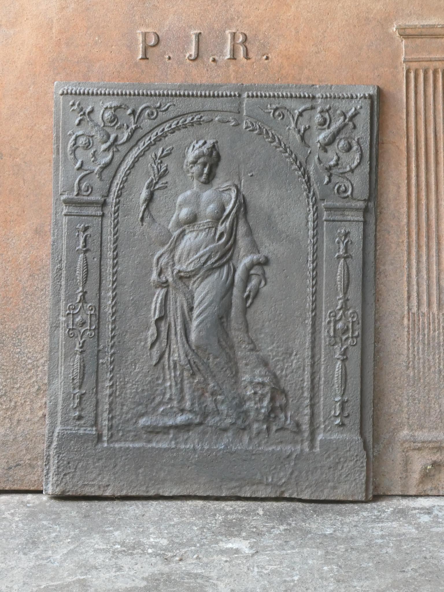 18/19th century French Neoclassical fireback with an allegory of Peace. The fireback is made of cast iron and has a natural brown patina. Upon request it can be made black / pewter. The fireback is in a good condition and does not have