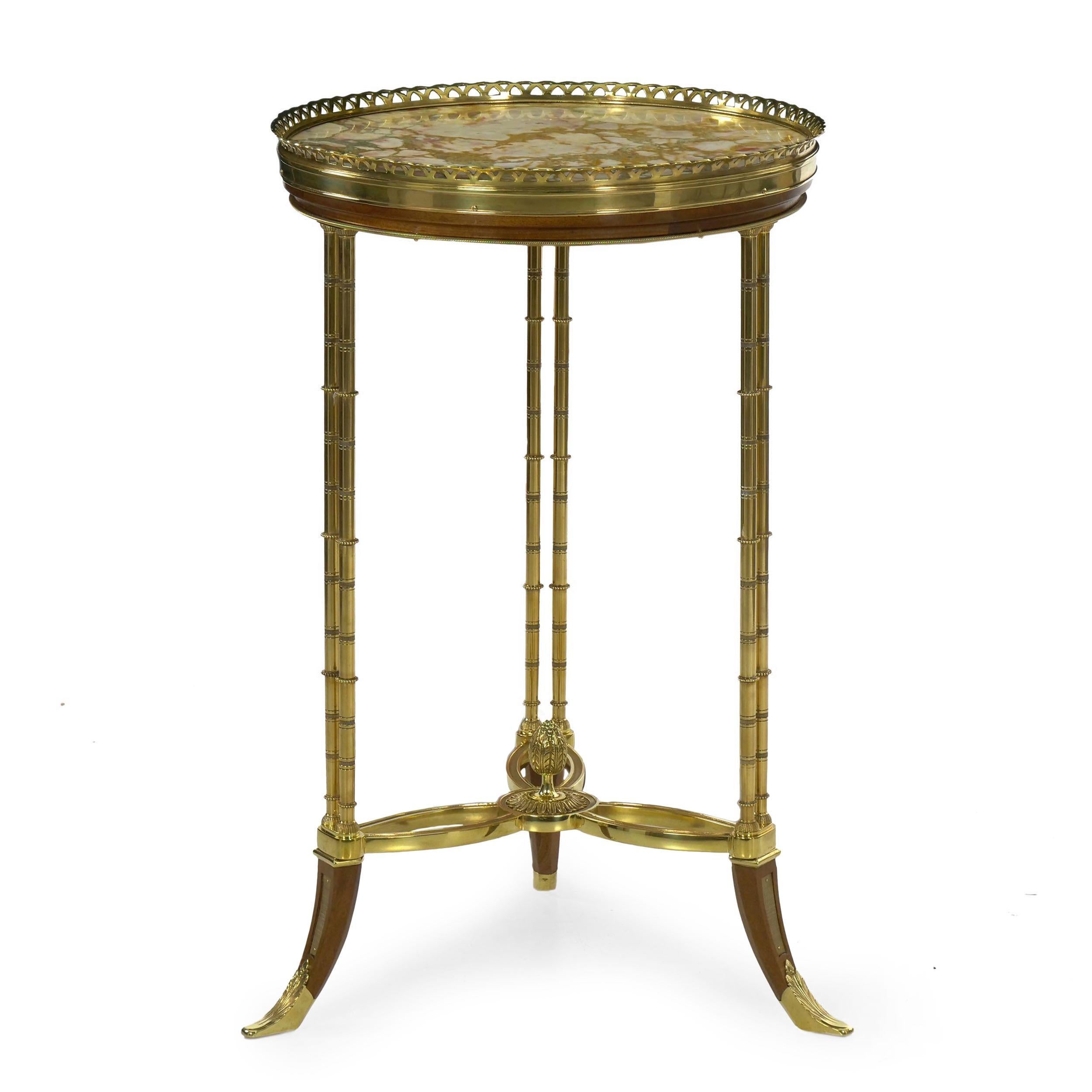 Of unusually fine quality, this extraordinary French neoclassical accent table is hand crafted of the most wonderful materials. Likely a product of the 1940s, it is executed in the manner and taste of Maison Jansen, produced for a moment in time