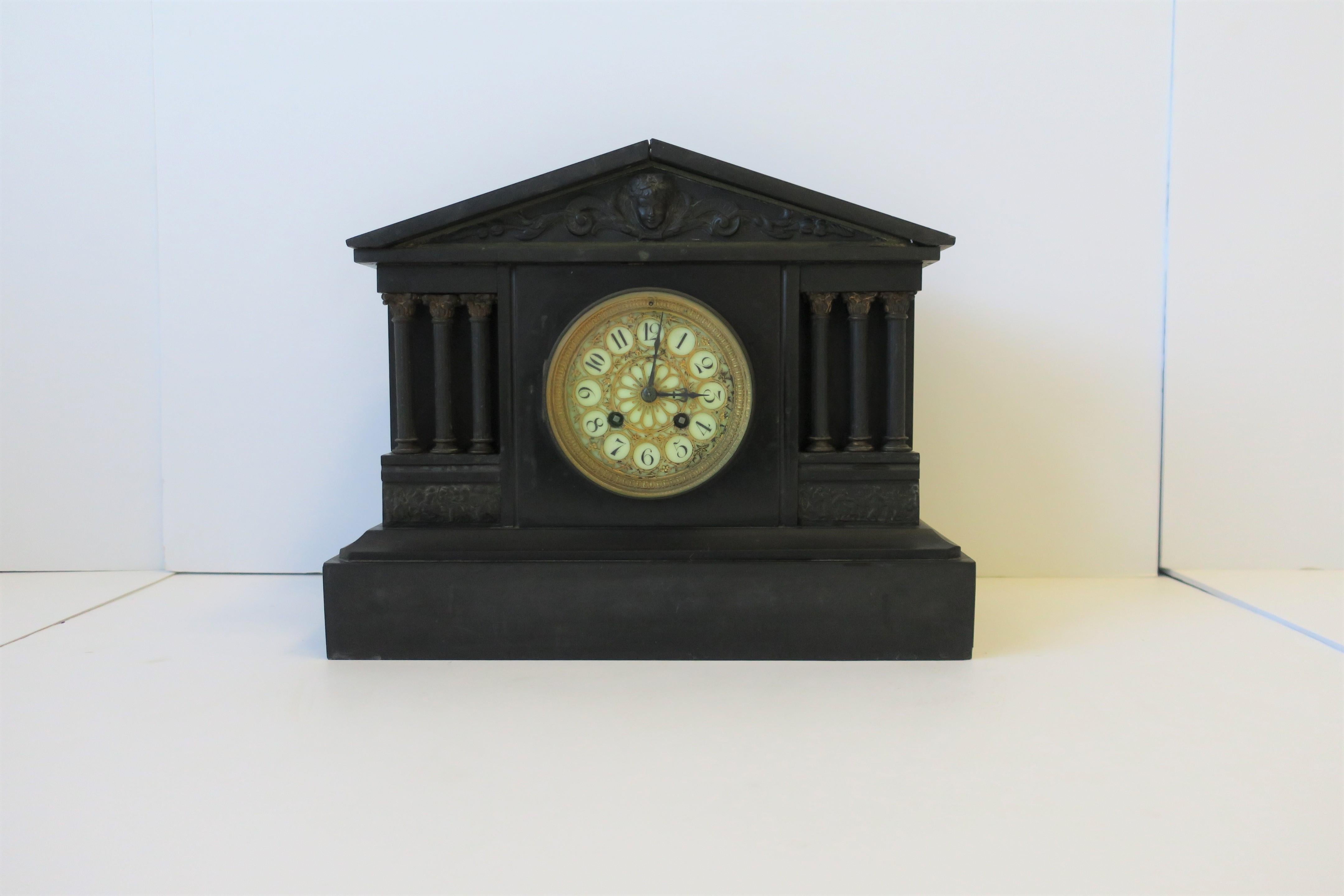 A beautiful antique French neoclassical black slate stone and gold gilt bronze mantel clock by Japy Freres, circa 19th century, France. This is a tremendous quality French black slate and bronze gilt mantel clock in the neoclassical style. The