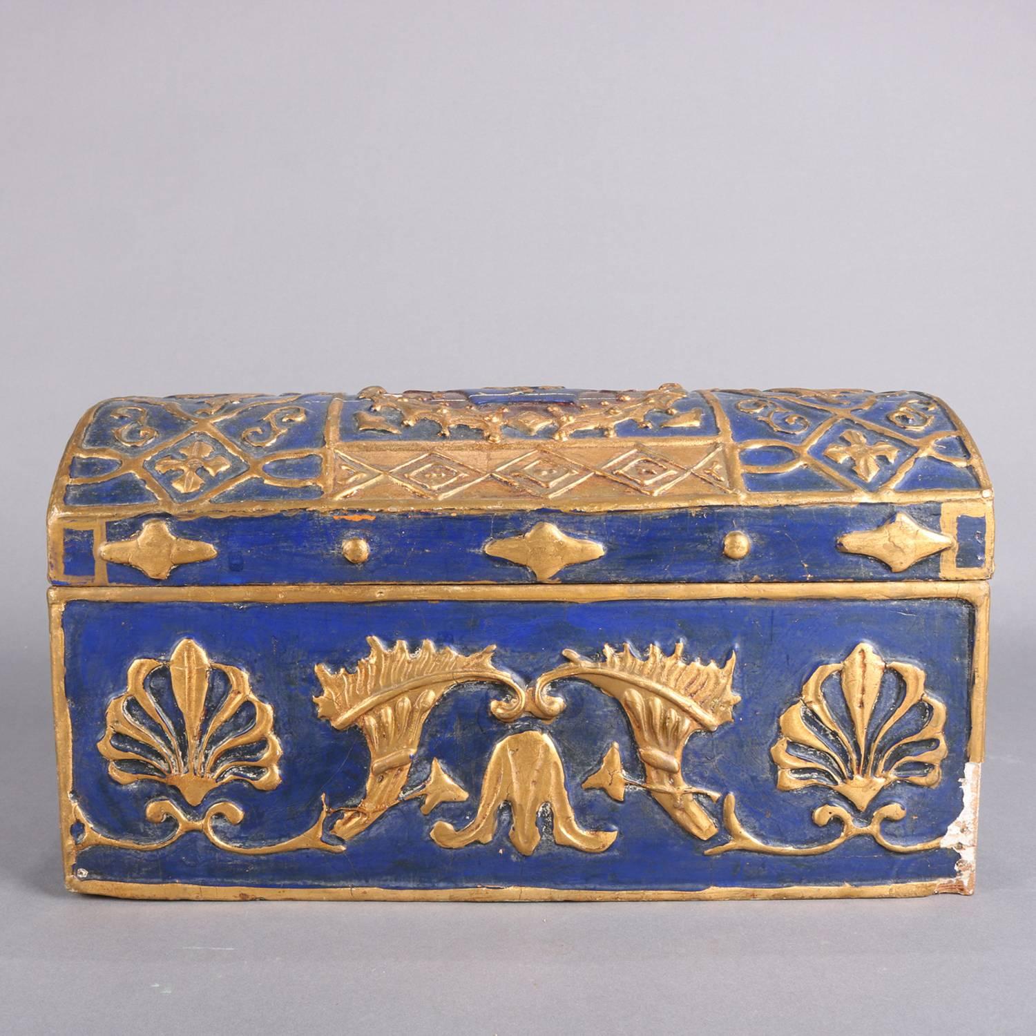 French neoclassical carved wood and plaster hinged dresser box features gilt palmette, scroll and foliate decoration, domed lid having central reserve with lion rampant, lined, 19th century

Measures: 7