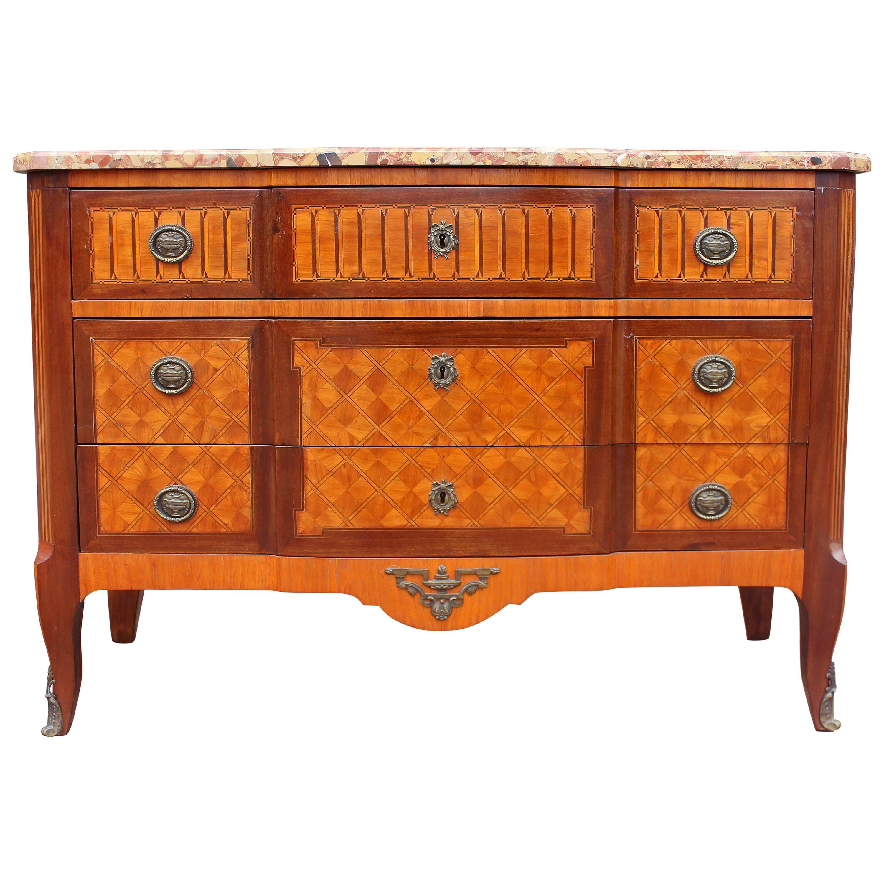 French neoclassical marble-top chest of drawers. Fine parquetry inlays with bronze mounts, mid-19th century.