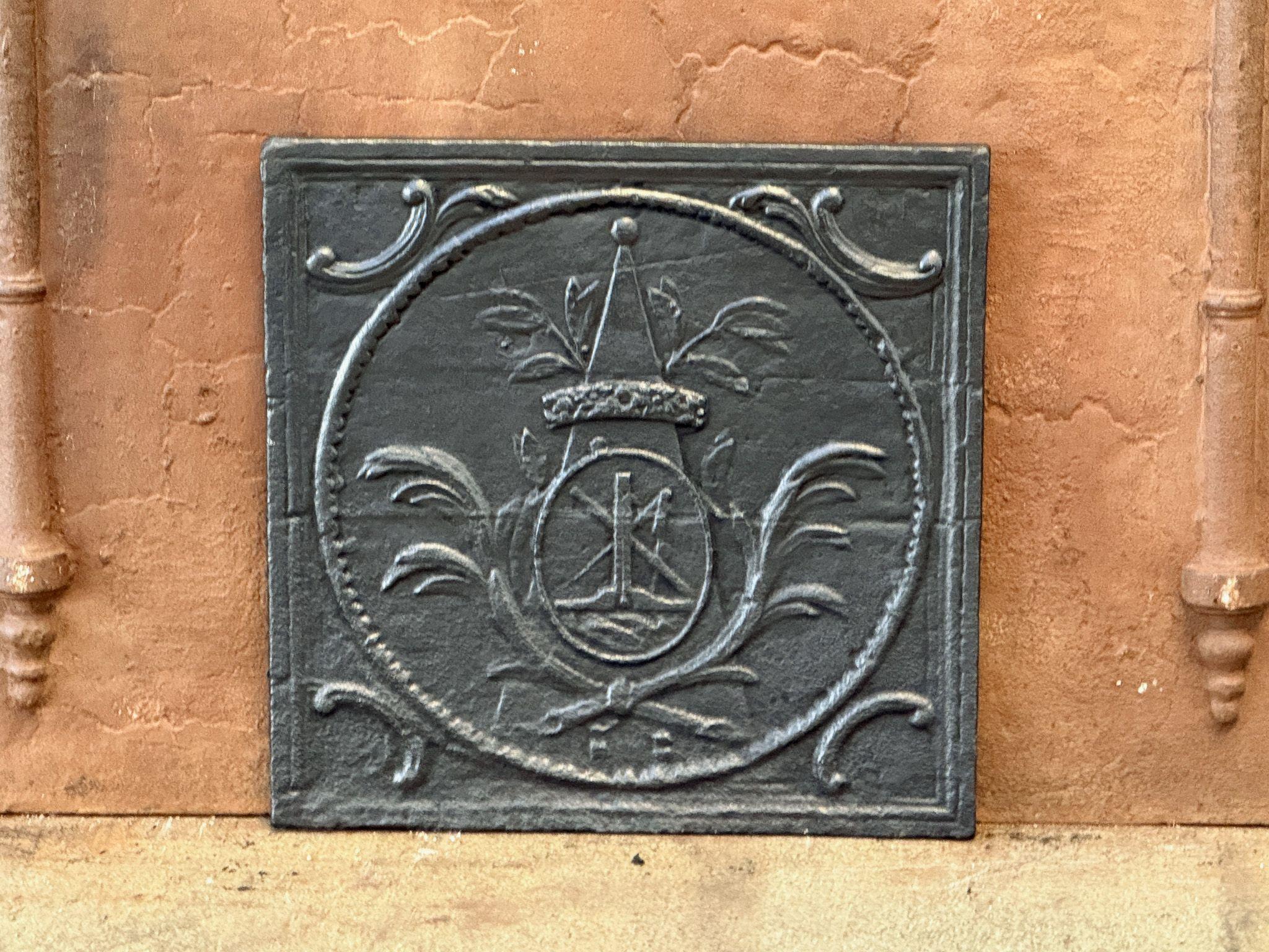 Late 18th or early 19th century French Neoclassical Period fireback with a decorated pyramid.

The fireback is made of cast iron and has a black / pewter patina. It is in a good condition and does not have cracks.