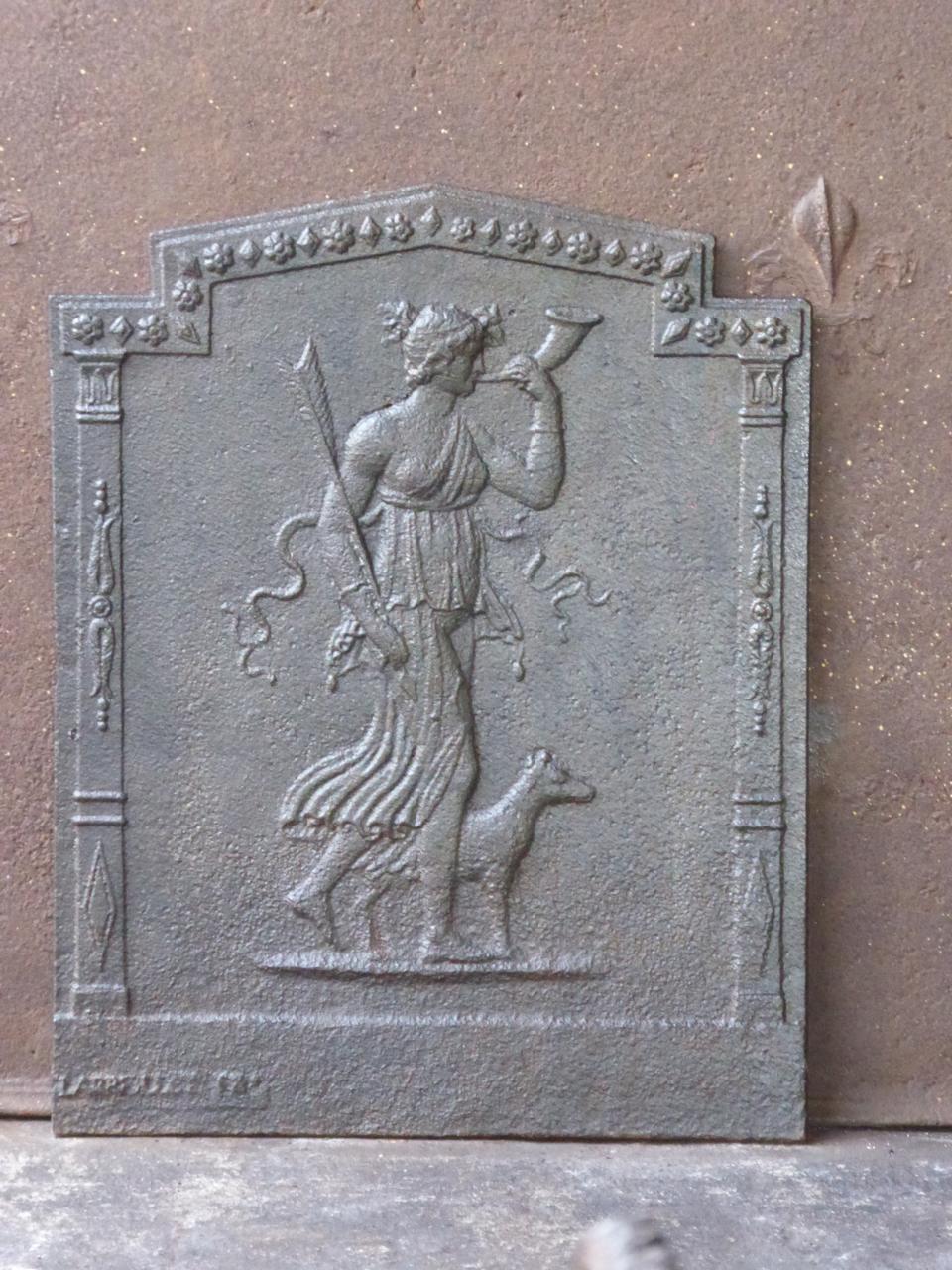 19th century French neoclassical fireback with the goddess Diana. Goddess of hunting, also protector of animals of the forest, especially the young animals. She experienced great pleasure in hunting, but took care that she did not kill more animals