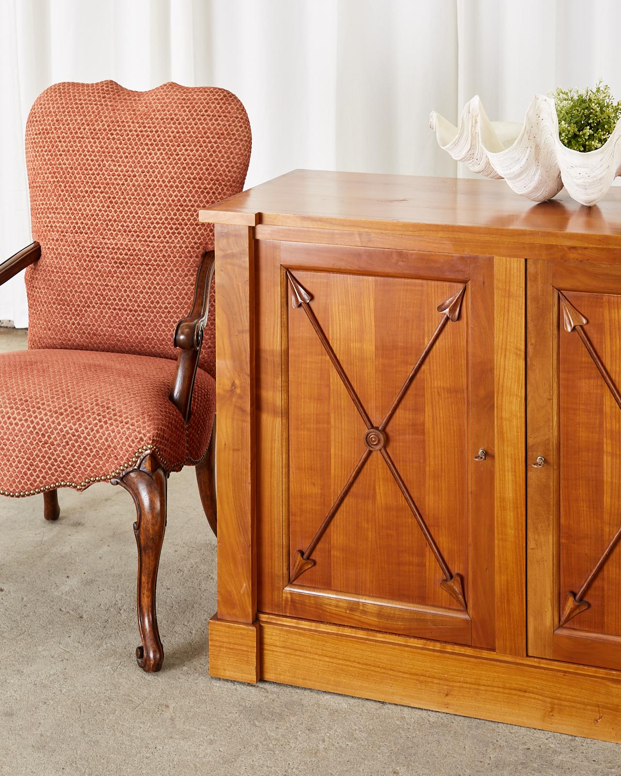 Handsome French fruitwood sideboard buffet or server crafted in the neoclassical directoire taste. The transitional Napoleonic style between Louis XVI and empire was strongly influenced by Greco-Roman motifs. The sideboard features a handsome case