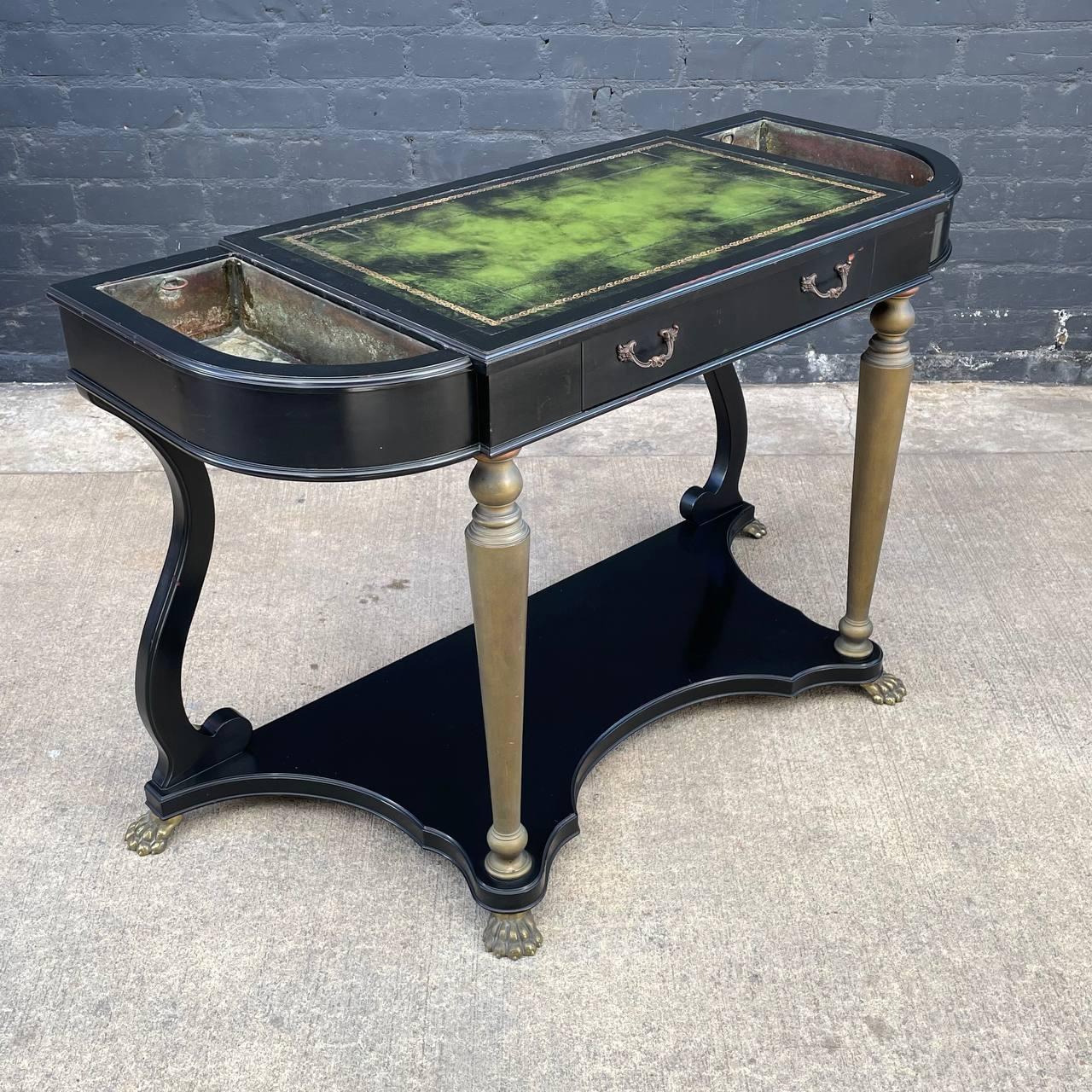 French Neoclassical Ebonized & Leather Top Console Table with Planter and Brass Claw Feet

Original Vintage Condition
Materials: Ebonized Wood, Leather Top, Patinated Brass
Dimensions: 31”H x 48”W x 19.75”D
