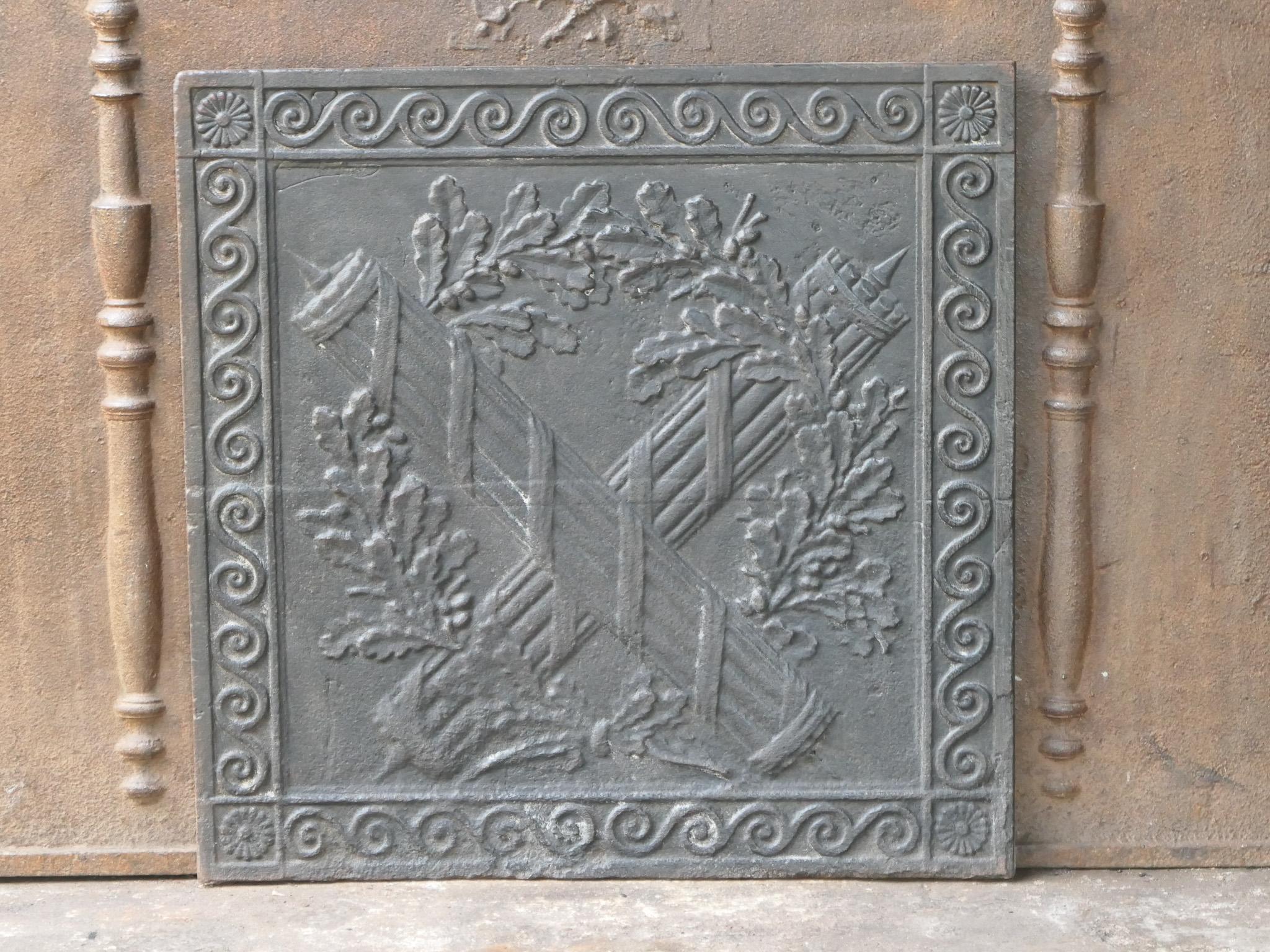 18th-19th century French neoclassical period fireback with fasces. Fasces are a bundle of rods tied around an axe, which was a symbol carried by lictors in ancient Rome to signify the authority and power of a magistrate. This symbol has been used