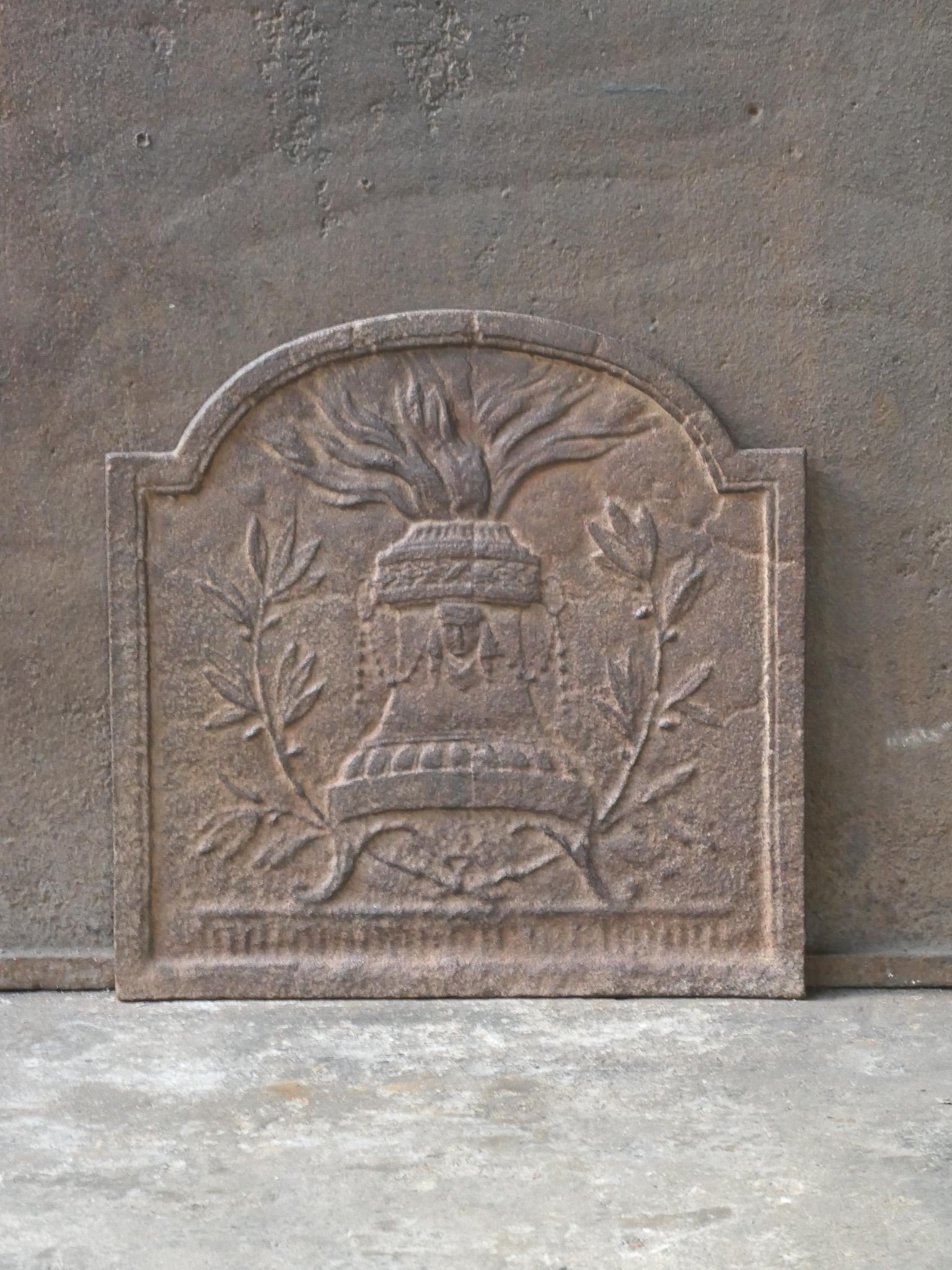 18th-19th century French neoclassical period fireback.

The fireback is made of cast iron. It has a natural brown patina. Upon request it can be made black / pewter at no extra cost. The fireback is in a good condition and does not have