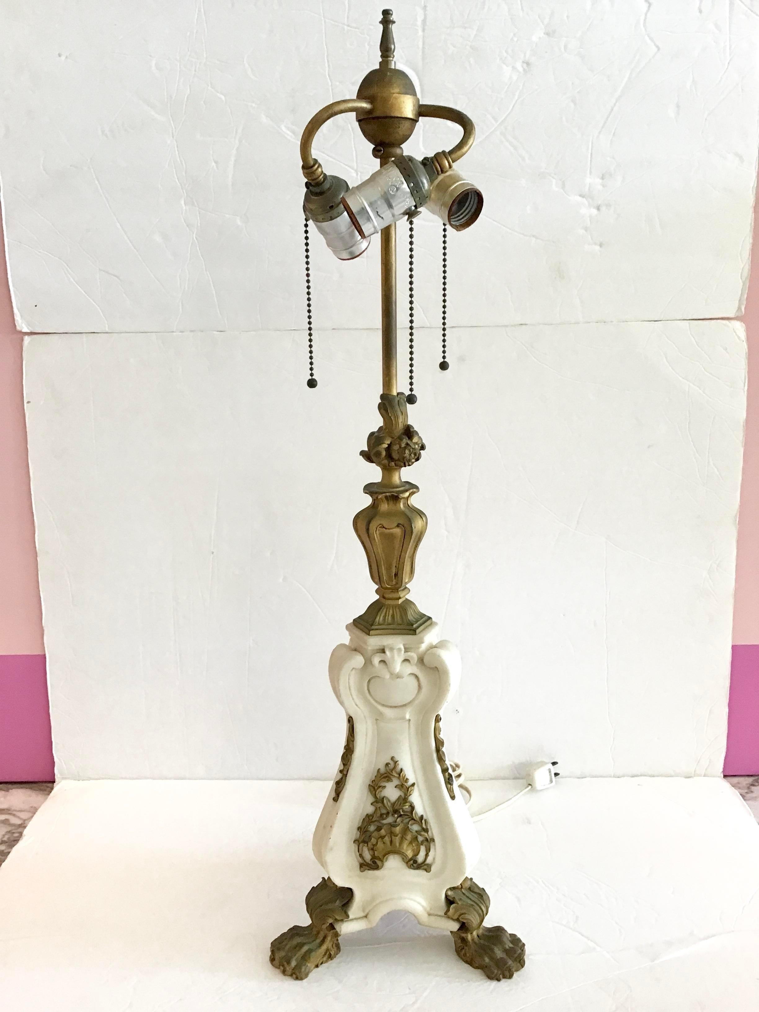 Fabulous French neoclassical table lamp with gilt bronze details on a hand carved marble form. Add some French Architecture to your home with beautiful neoclassical shape.