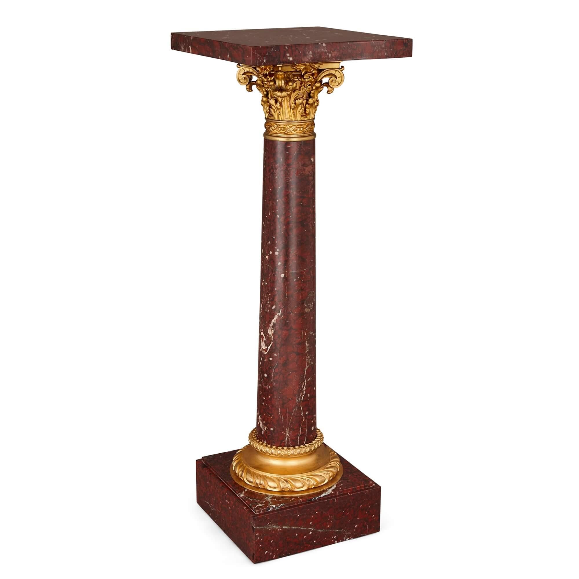 French Neoclassical gilt-bronze and rouge griotte marble pedestal.
French, 19th century.
Measures: height 123 cm, width 41 cm, depth 41 cm.

In an highly pleasing combination of ormolu (gilt-bronze) and rouge griotte marble, this very fine