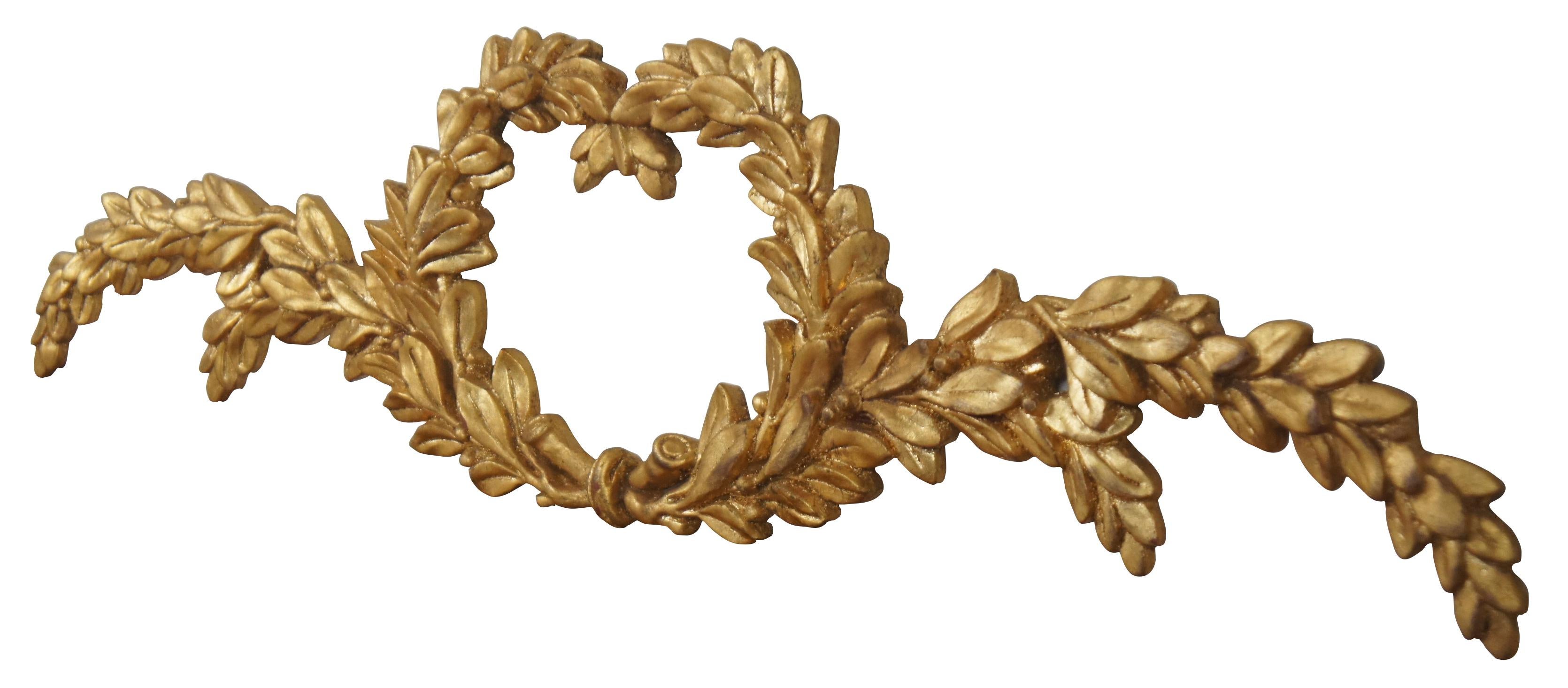 Elegant vintage Louis XVI Neoclassical style carved giltwood garland wall plaque or architectural pediment carved in the shape of sweeping laurel wreath branches. Measure: 30