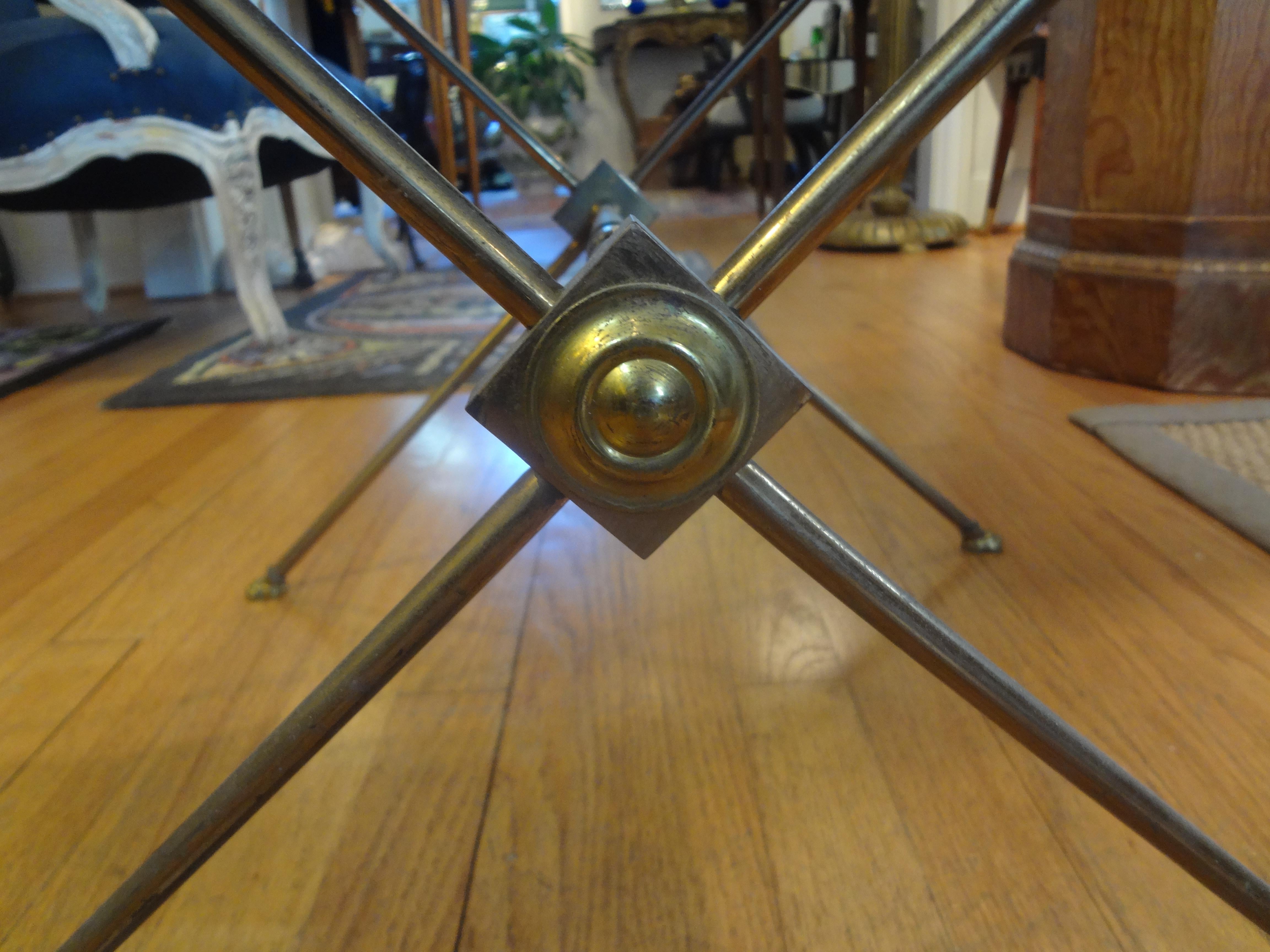 French Maison Bagués style brass table with mirrored top.
Charming square French Maison Baguès or Maison Jansen style brass or bronze table or guéridon. This French Neoclassical style table with a mirrored top and paw feet dates to the 1940s. This