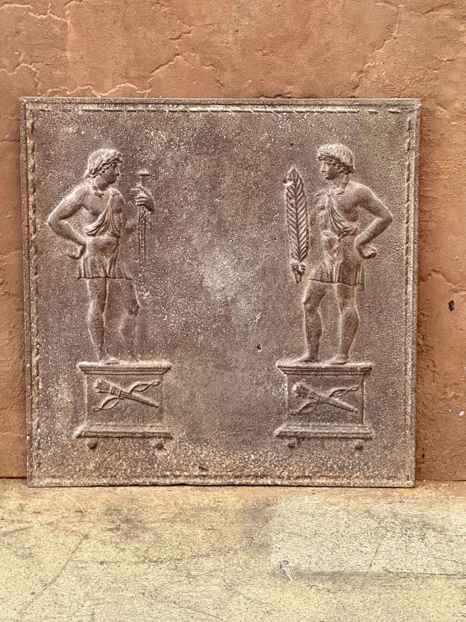 Early 19th century French Neoclassical Period fireback with two Roman men.

The fireback is made of cast iron and has a natural brown patina. Upon request, it can be made black/pewter at no extra cost. It is in good condition and does not have