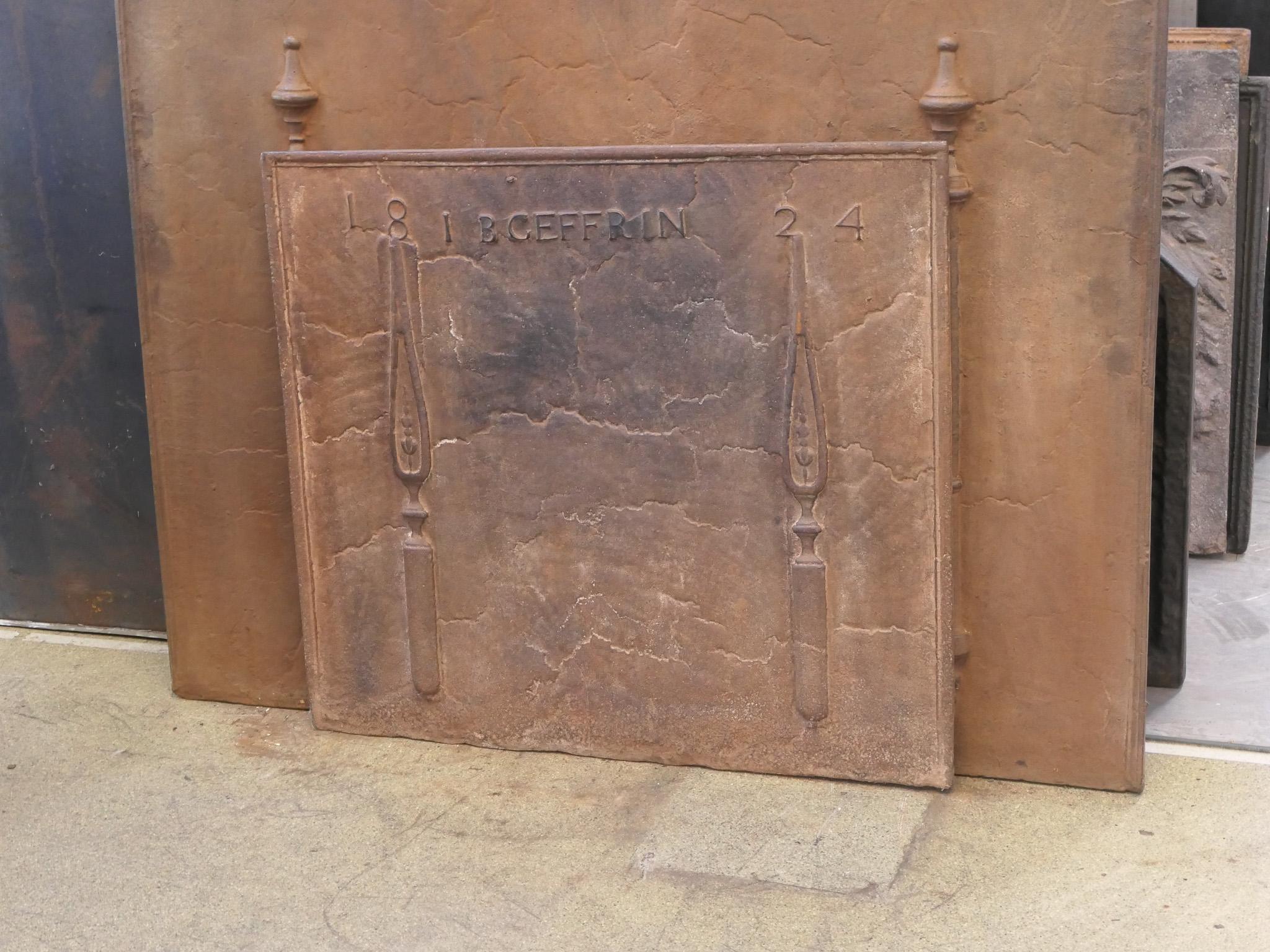 19th century French Neoclassical Period fireback. The date of production, 1824, is cast in the fireback.

The fireback is made of cast iron and has a natural brown patina. Upon request, it can be made black/pewter at no extra costs. 