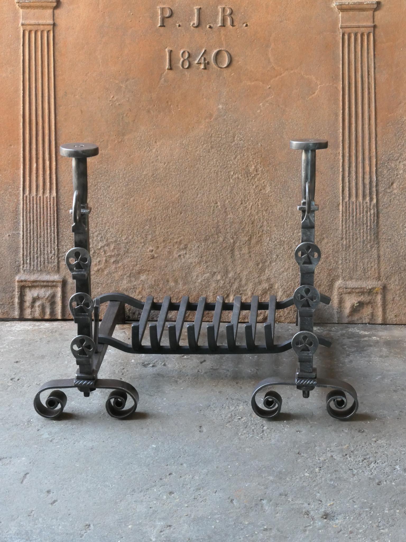 Late 18th / early 19th century French Neoclassical period fire grate. Made of beautifully forged wrought iron. The condition is good.

The width at the front is 66 cm (26.0 inches)





  