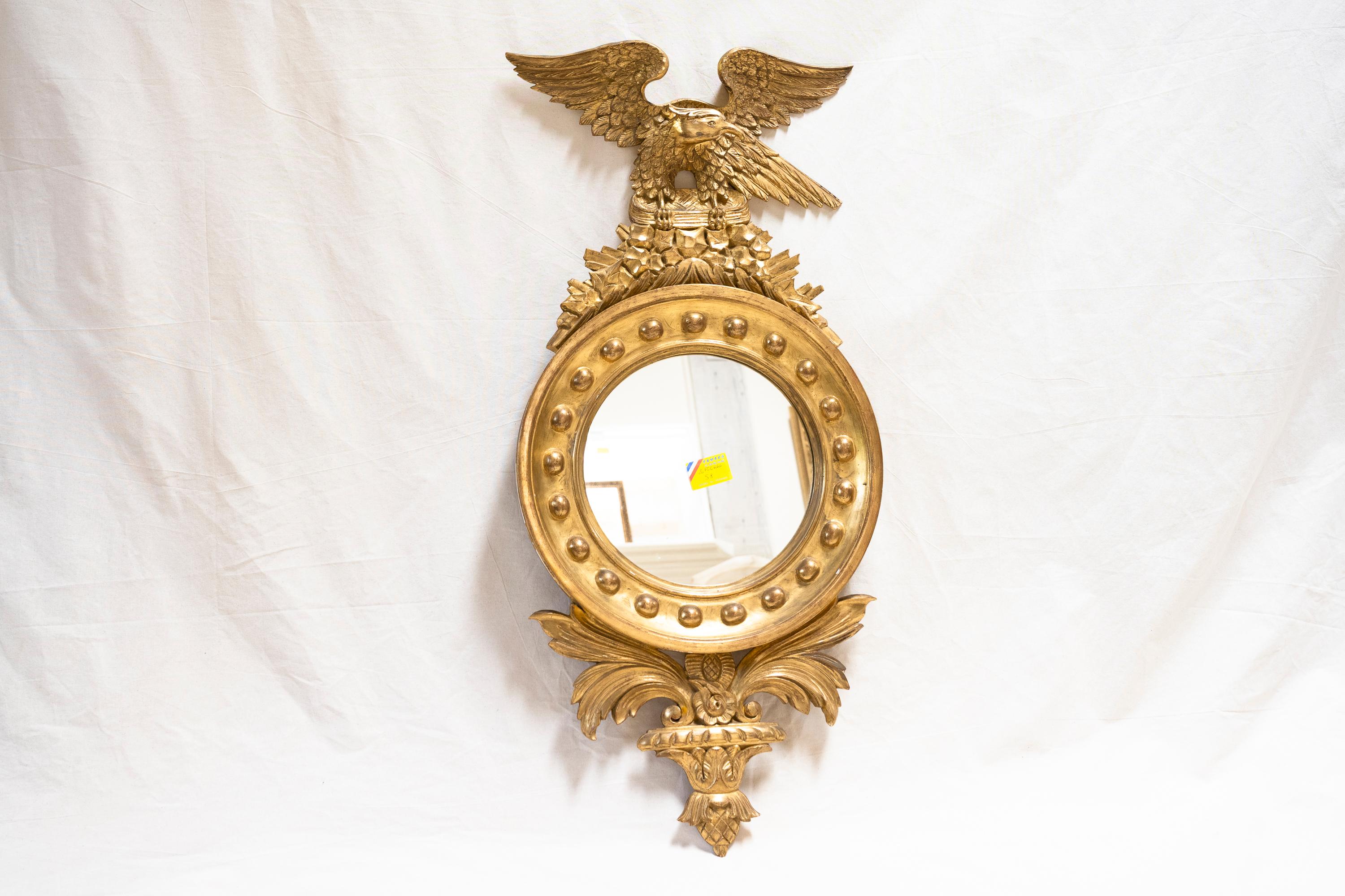 Rare French Second Empire period carved gilt wood round mirror, decorated with ball molded frame, with imperial eagle atop with wings spread, acanthus leaves below. 

Provenance: Summer estate in Saint-Cyprien, France.