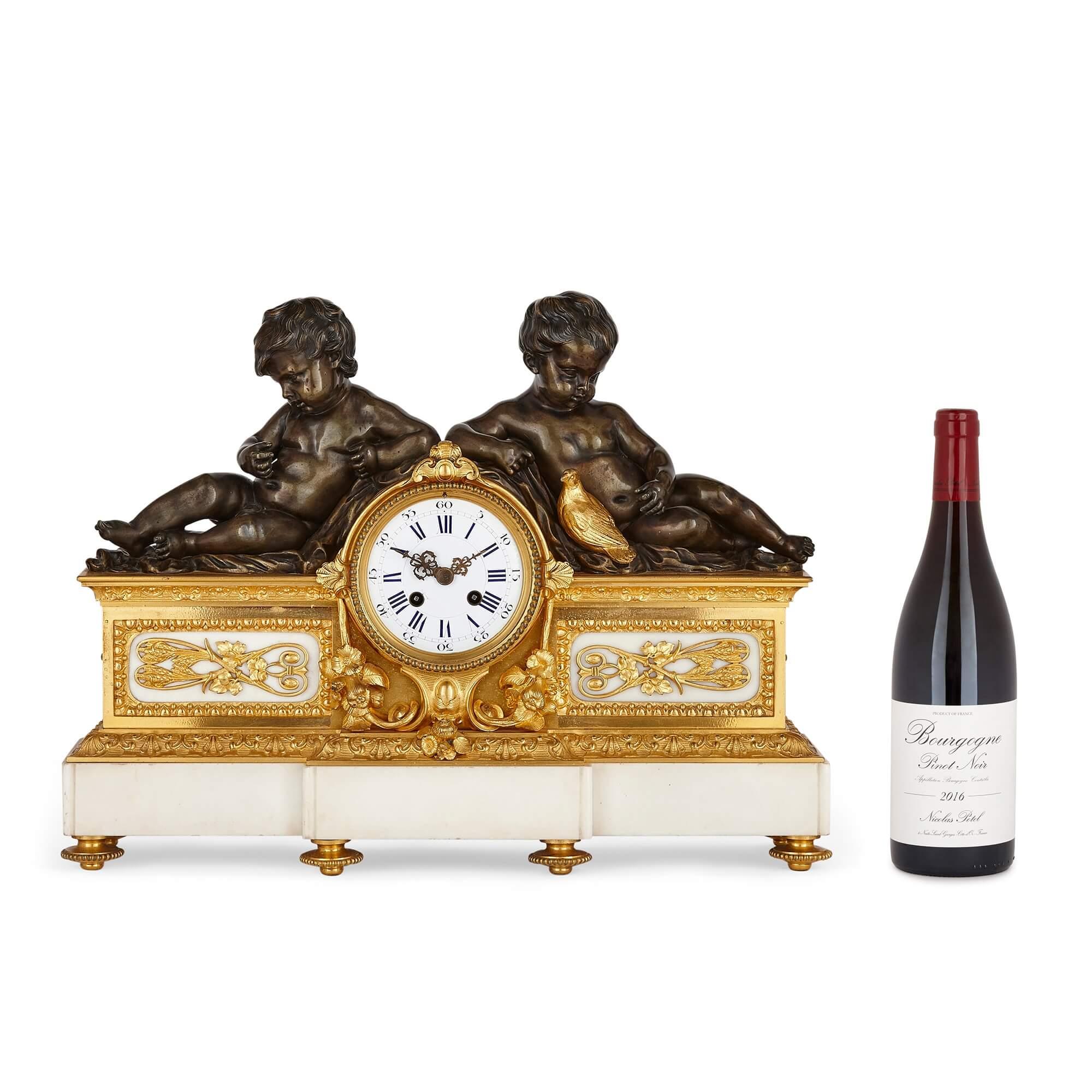 French neoclassical style bronze and marble three-piece clock set
French, 19th century
Clock: Height 38cm, width 50cm, depth 15cm
Candelabra: Height 62cm, width 27cm, depth 20cm

This beautiful three-piece clock set, featuring a mantel clock