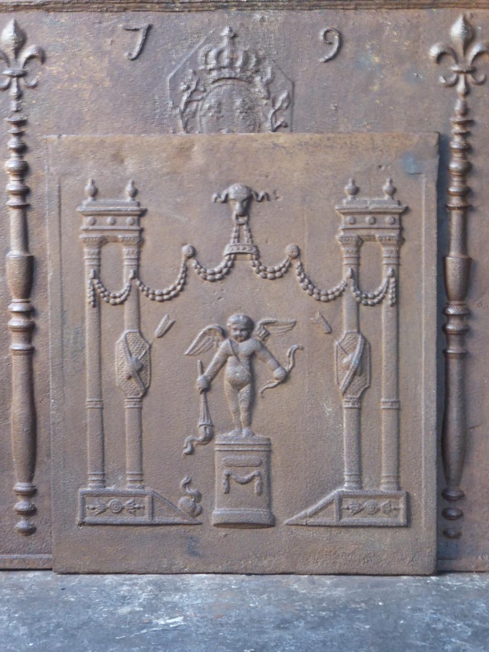 French neoclassical style fireback with a cupid surrounded by other decorations. The fireback is made of cast iron and has a natural brown patina. Upon request it can be made black.








     
