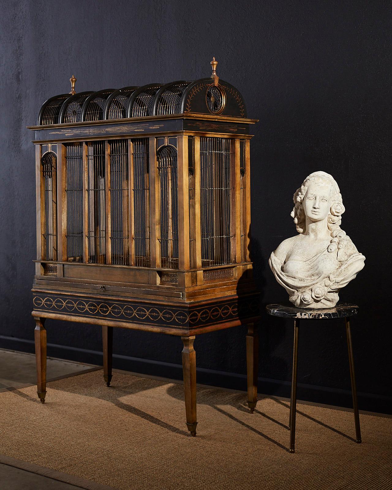 Magnificent French neoclassical styled bird cage custom made by Eric Lansdown. This grand cage features a walnut frame with cage wire that is hand-strung, hand-tied, and soldered. The frame is decorated with hand gilding. Eric describes this one of