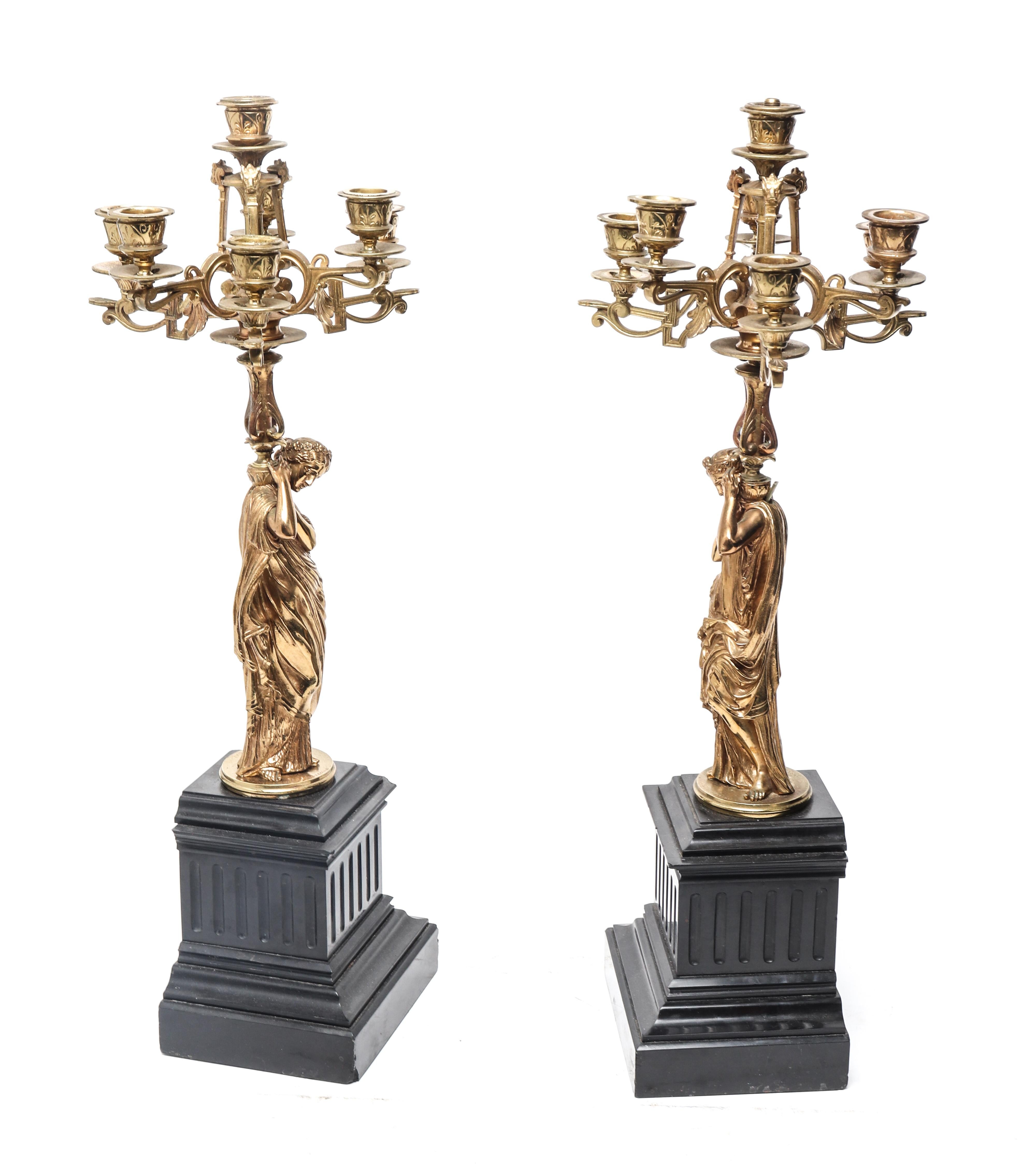 French neoclassical style pair of ormolu and stone figural seven-light candelabras, the ormolu figures after Mathurin Moreau. Made in the early 20th century and inscribed 