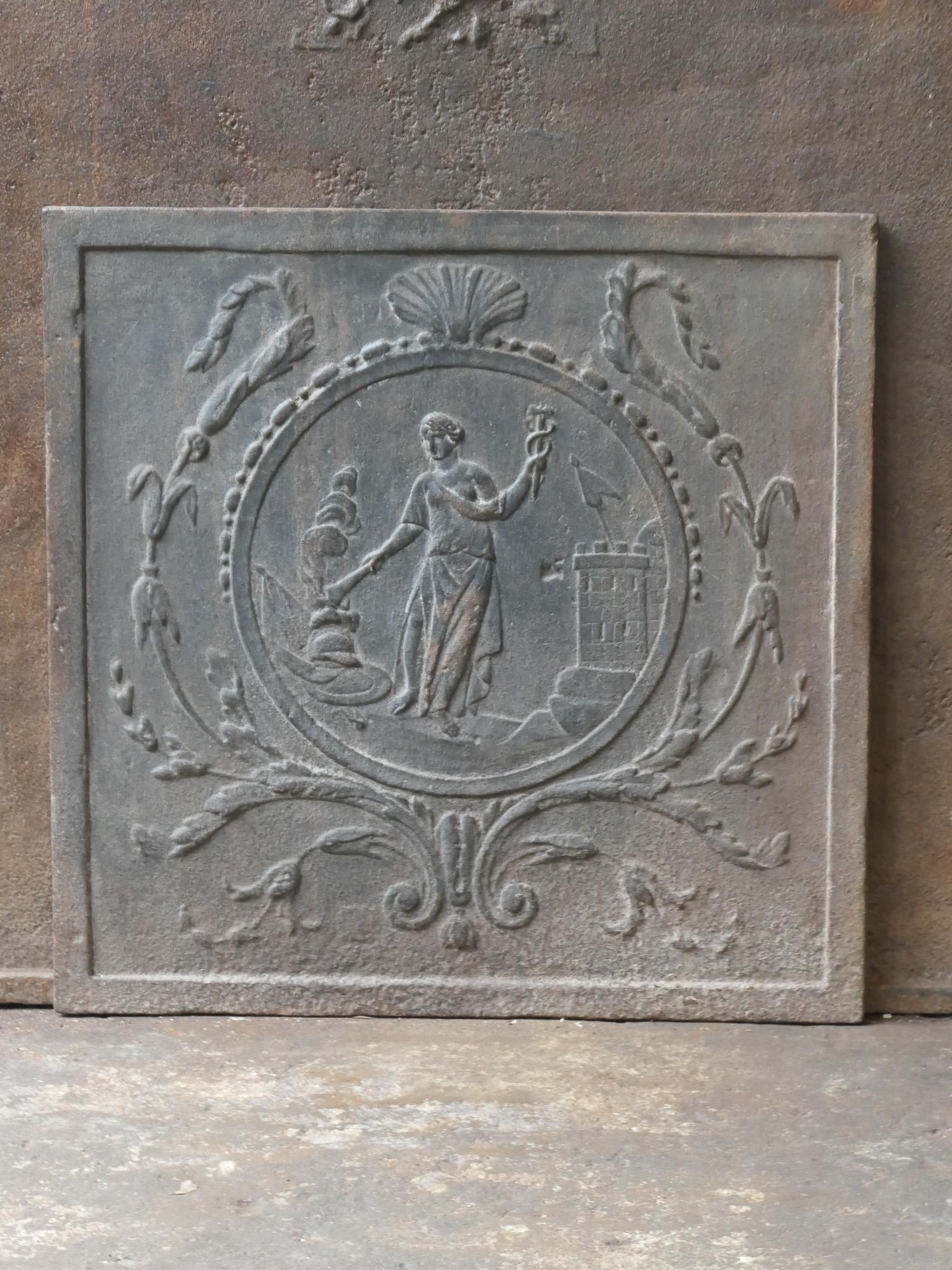 20th Century French Neoclassical Style fireback / backplash with the goddess Hestia.

The torch is the symbol of Hestia, goddess of fire and more specifically the domestic hearth. Where no fire is found, a cozy, regulated society is impossible.