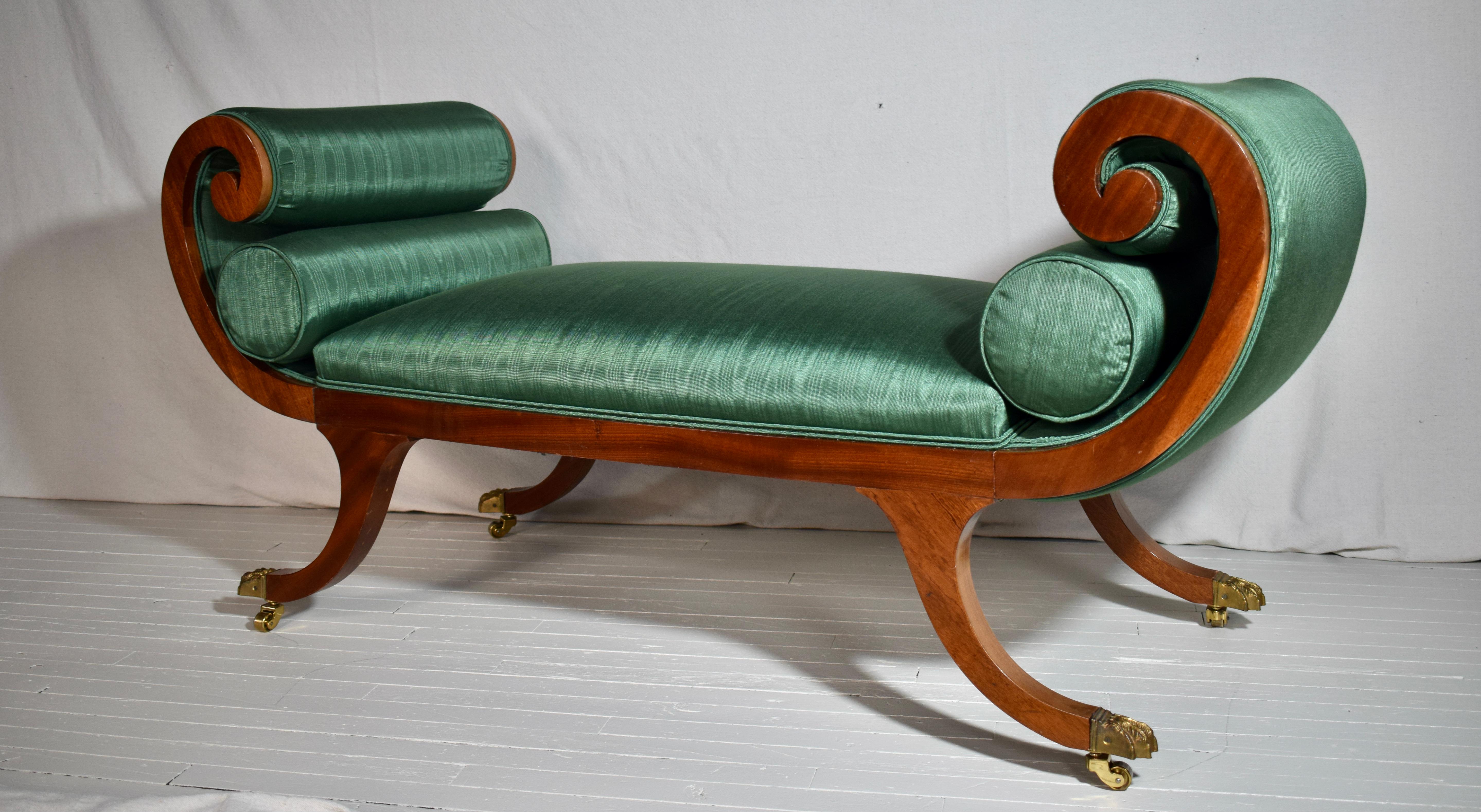 An elegant Mahogany scroll arm Recamiere, Meridian or window bench much like Maitland Smith or Baker pieces. Features Include new custom Moire upholstery, two bolster cushions with brass paw feet and casters. The Mahogany wood grains & vibrant green