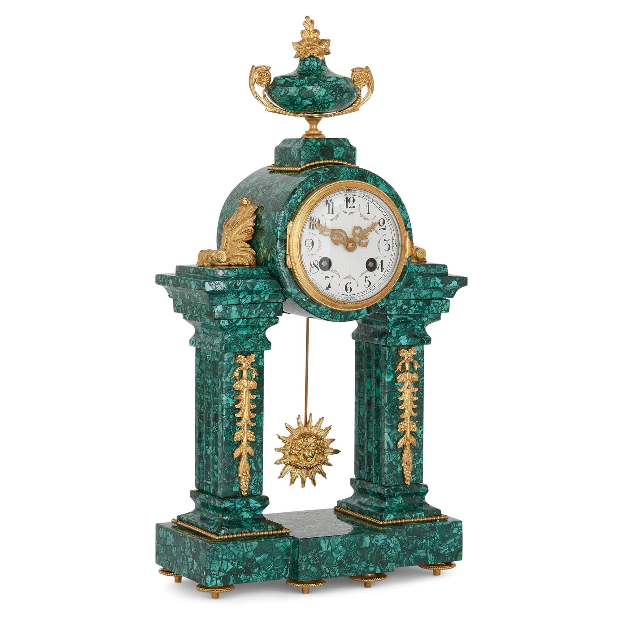 French Neoclassical style malachite and gilt bronze mantel clock
French, late 19th Century
Measures: height 42cm, width 22cm, depth 11cm

This fine clock is crafted in the Louis XVI Neoclassical style from malachite and gilt bronze—with the