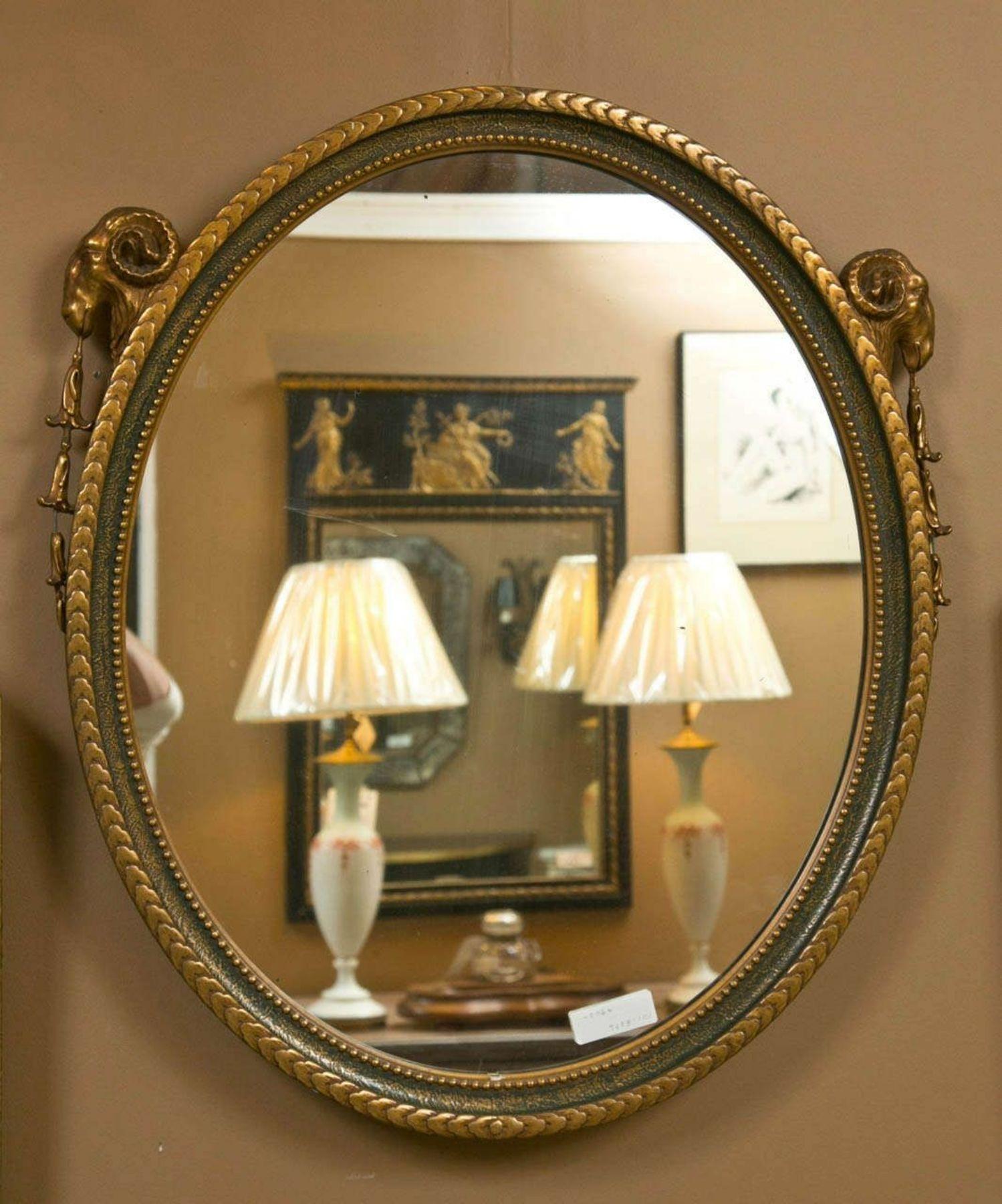 French Neoclassical Style Oval Mirror With Rams Head Design Paint And Gilded In Good Condition In Stamford, CT
